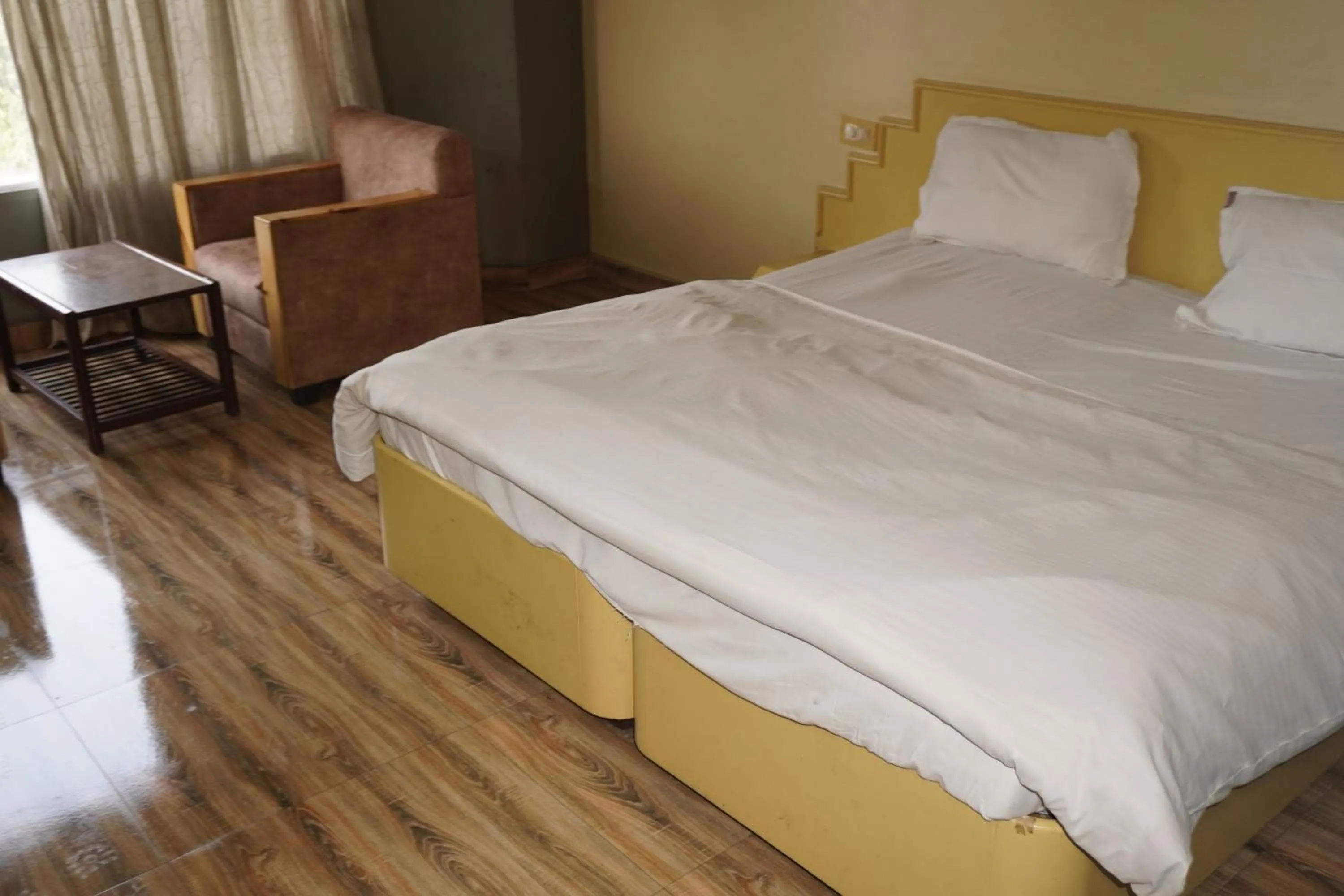 Bed in Hotel Maya international