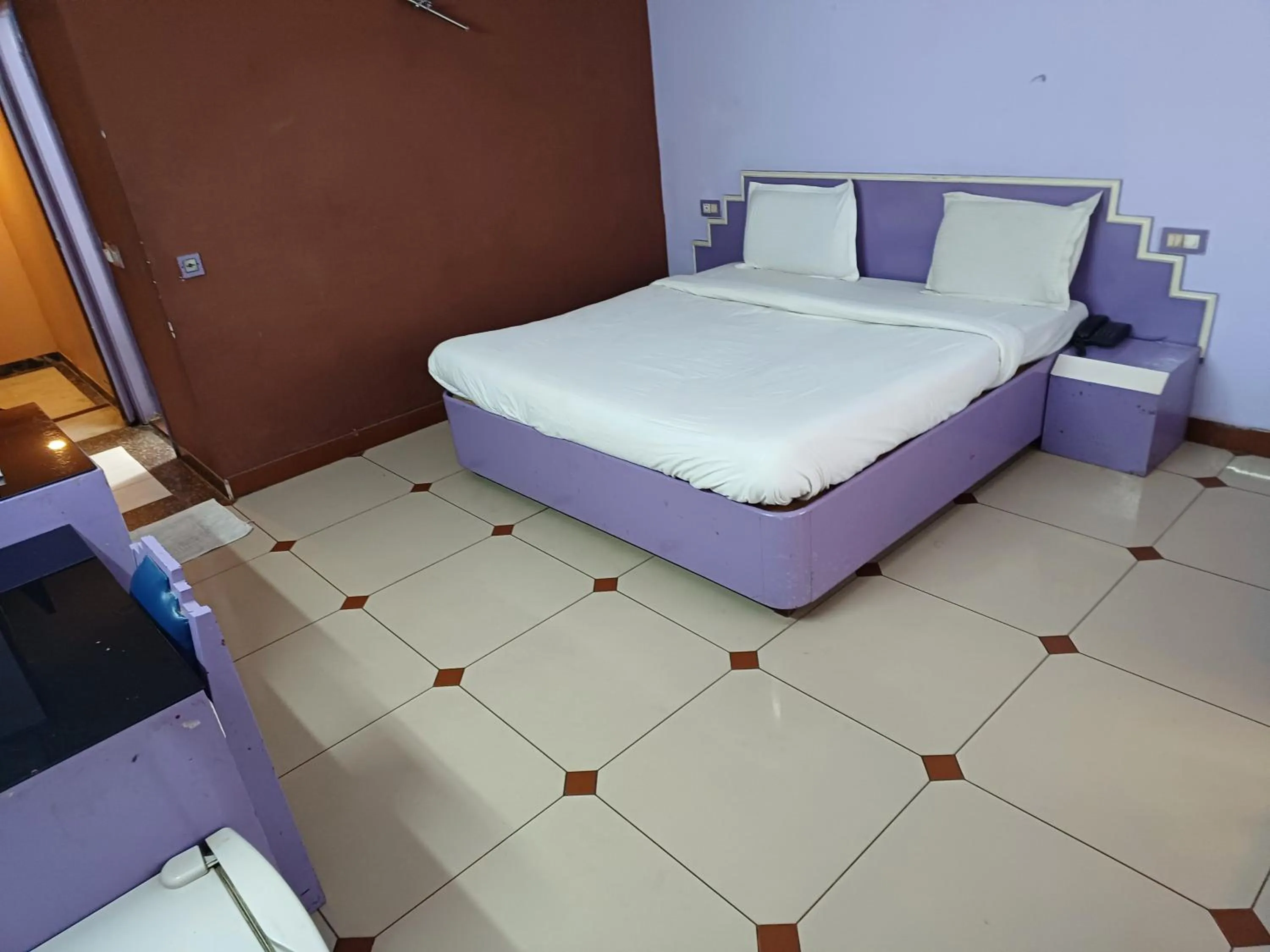 Bed in Hotel Maya international