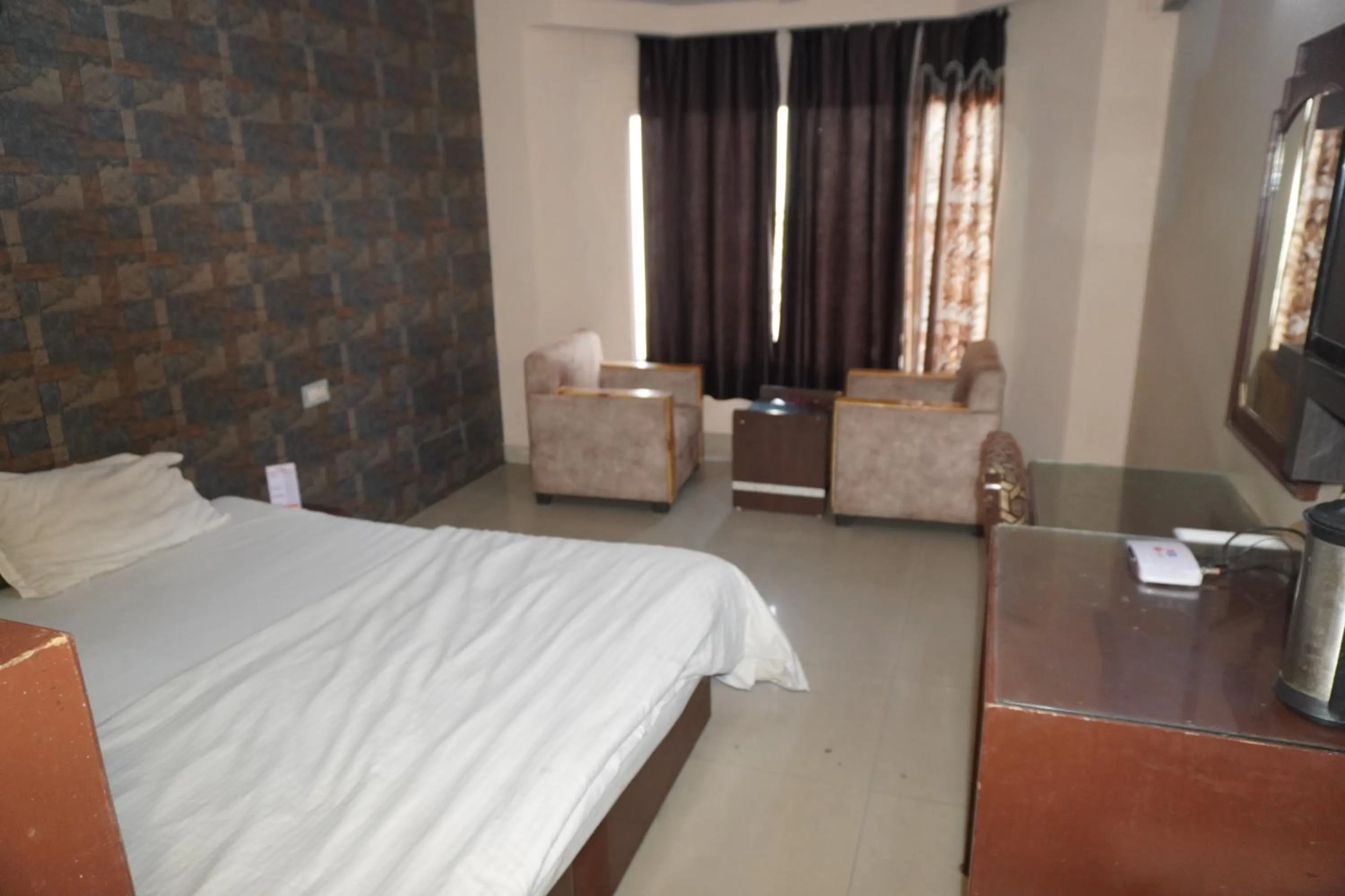 Bed in Hotel Maya international