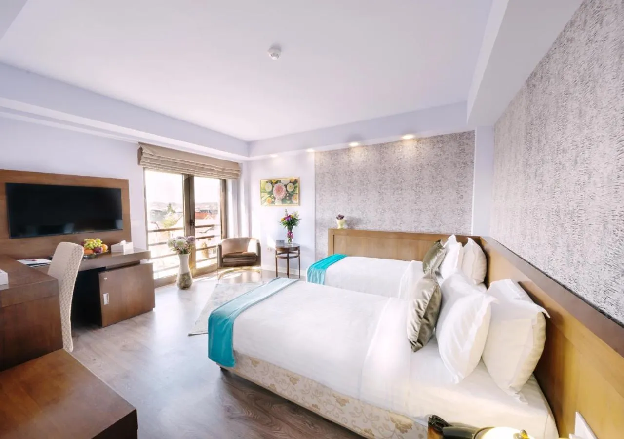 Bed in Phoenicia Comfort Hotel