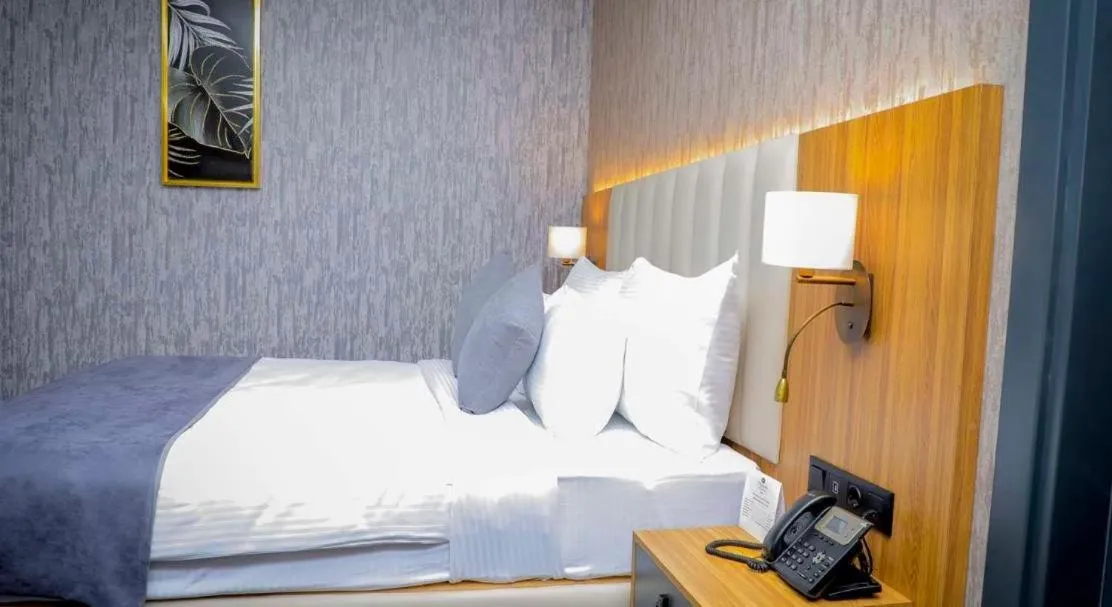 Bed in Best Western Premier DJ Hotel