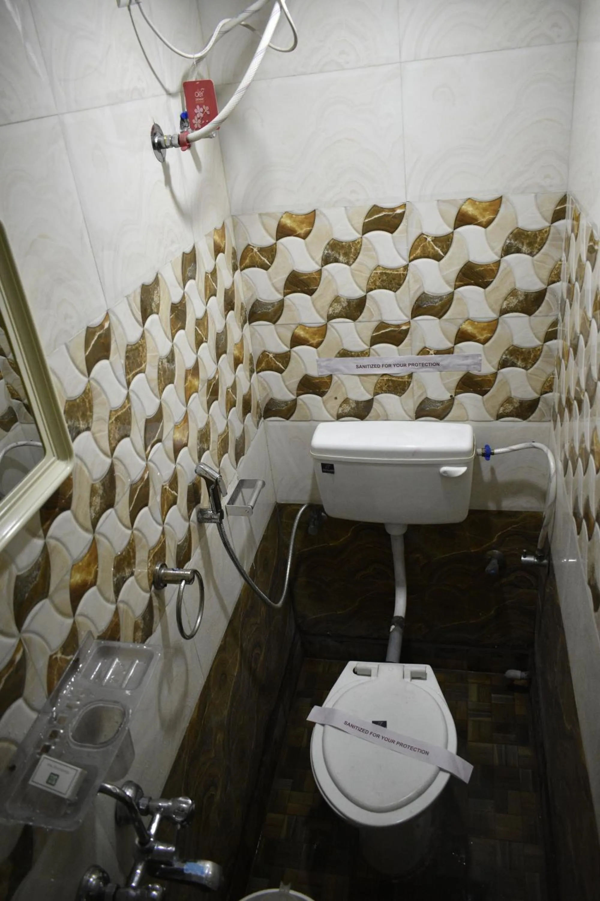 Toilet in Ya Inn Rooms & Suites