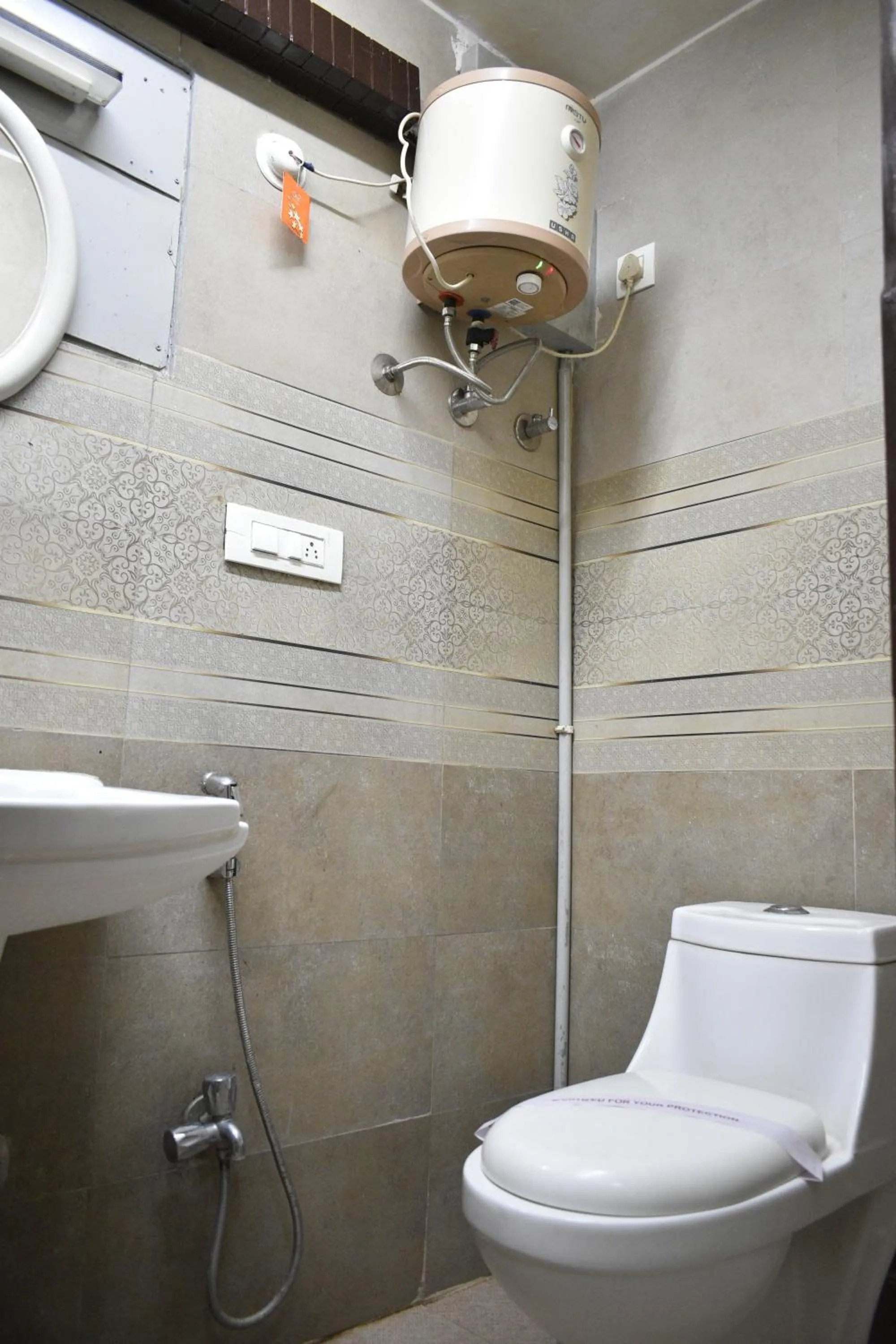 Toilet in Ya Inn Rooms & Suites