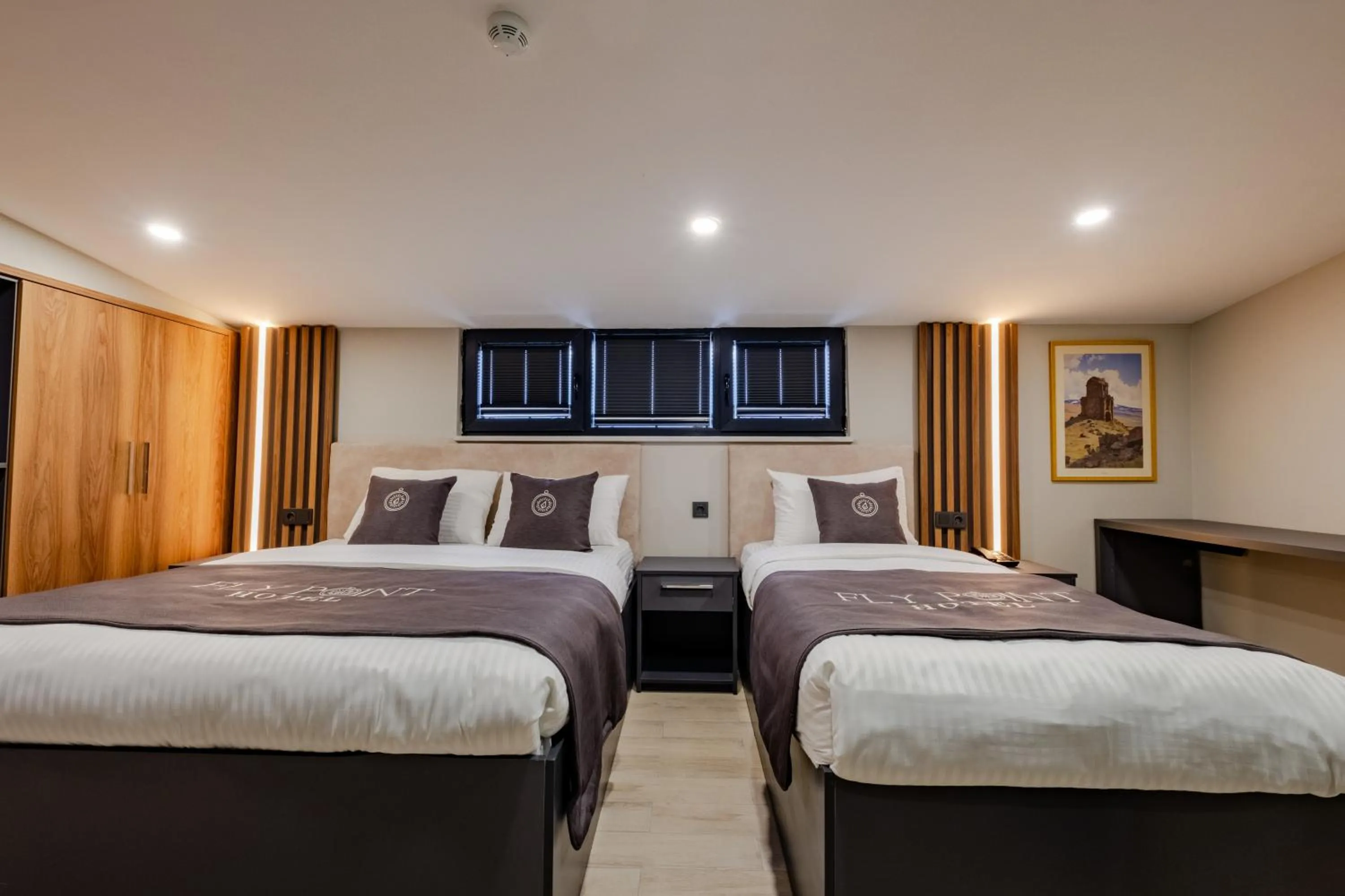 Bed in FLY POINT AIRPORT HOTEL