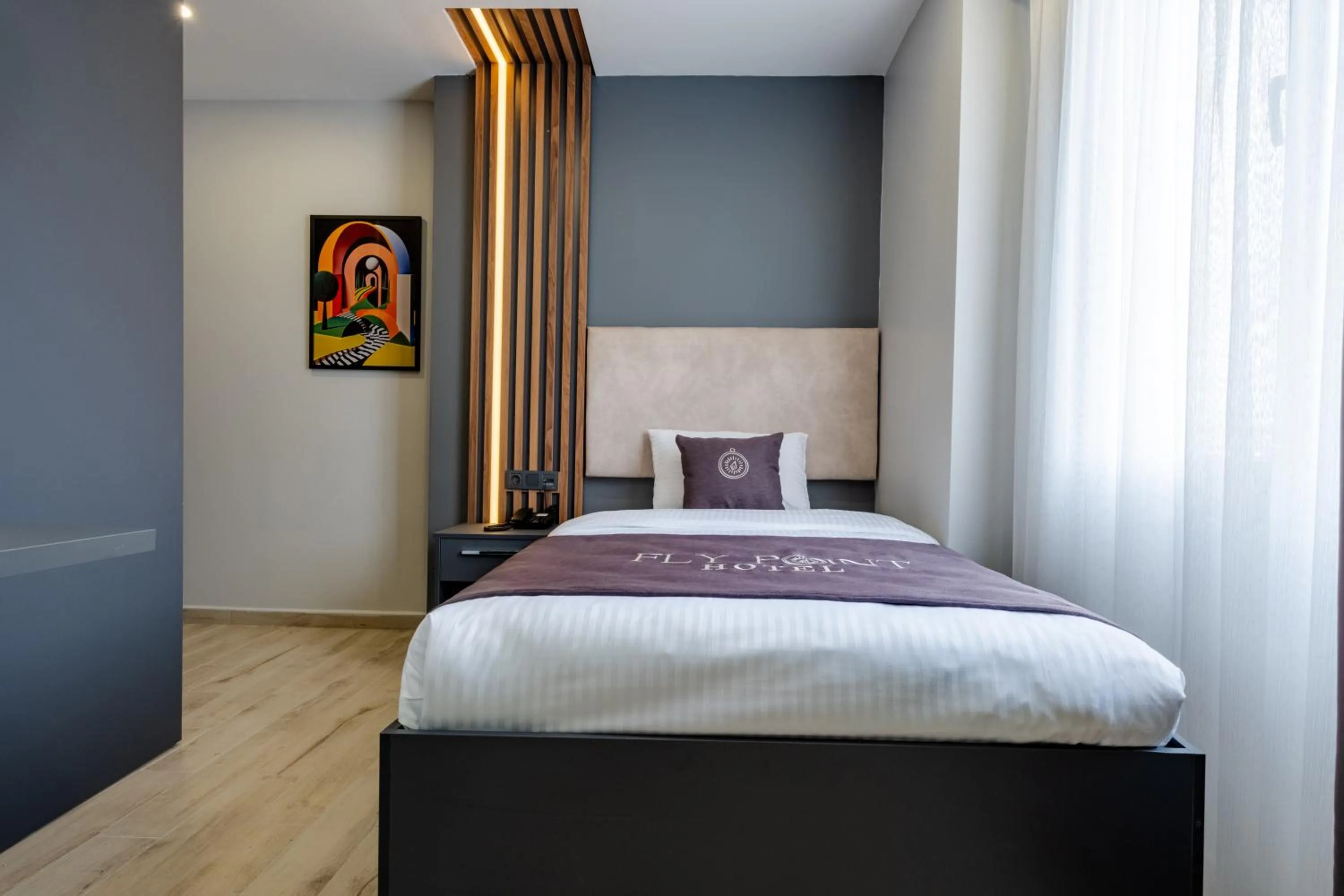 Bed in FLY POINT AIRPORT HOTEL