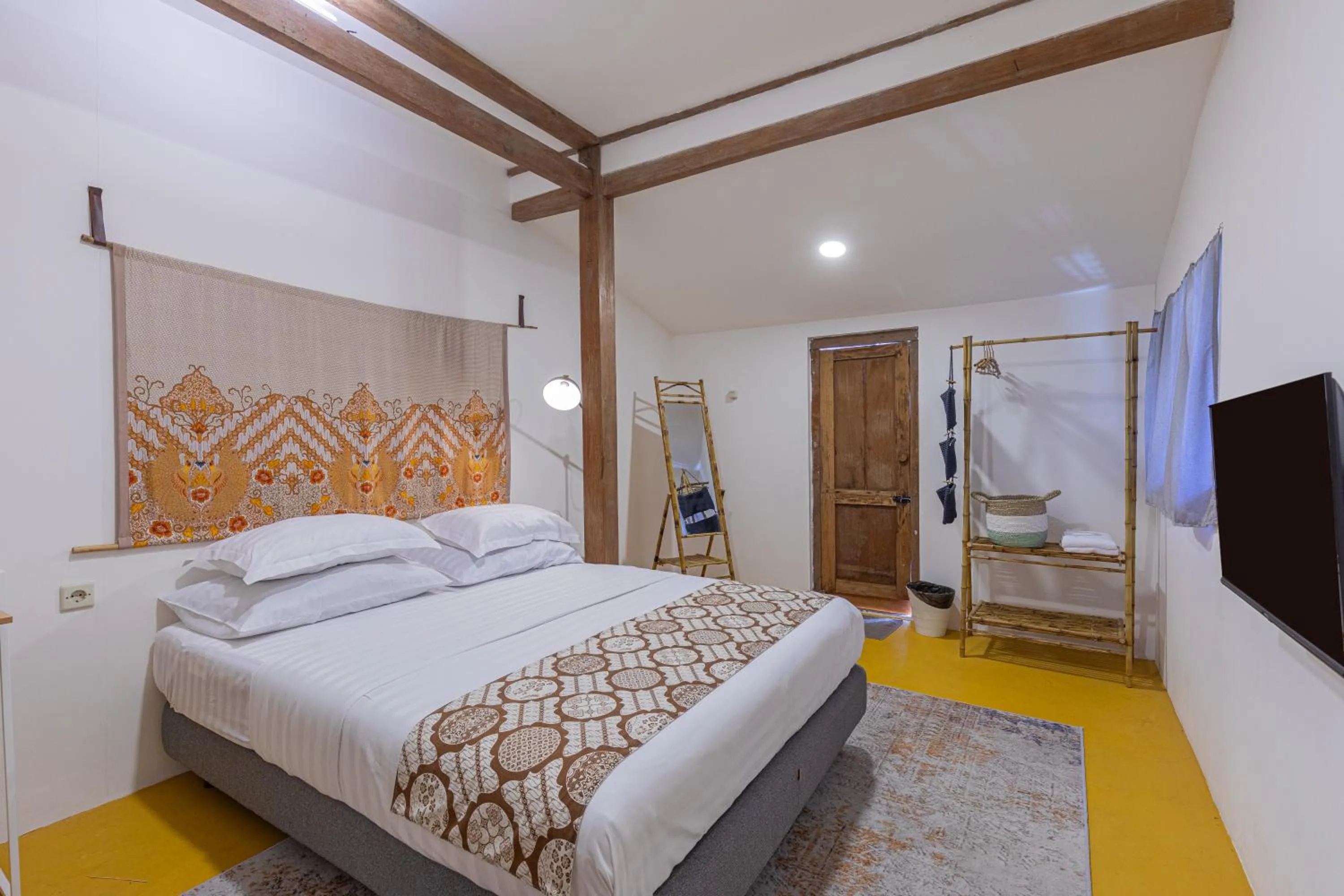 Bed in Yukke Tembi Homestay