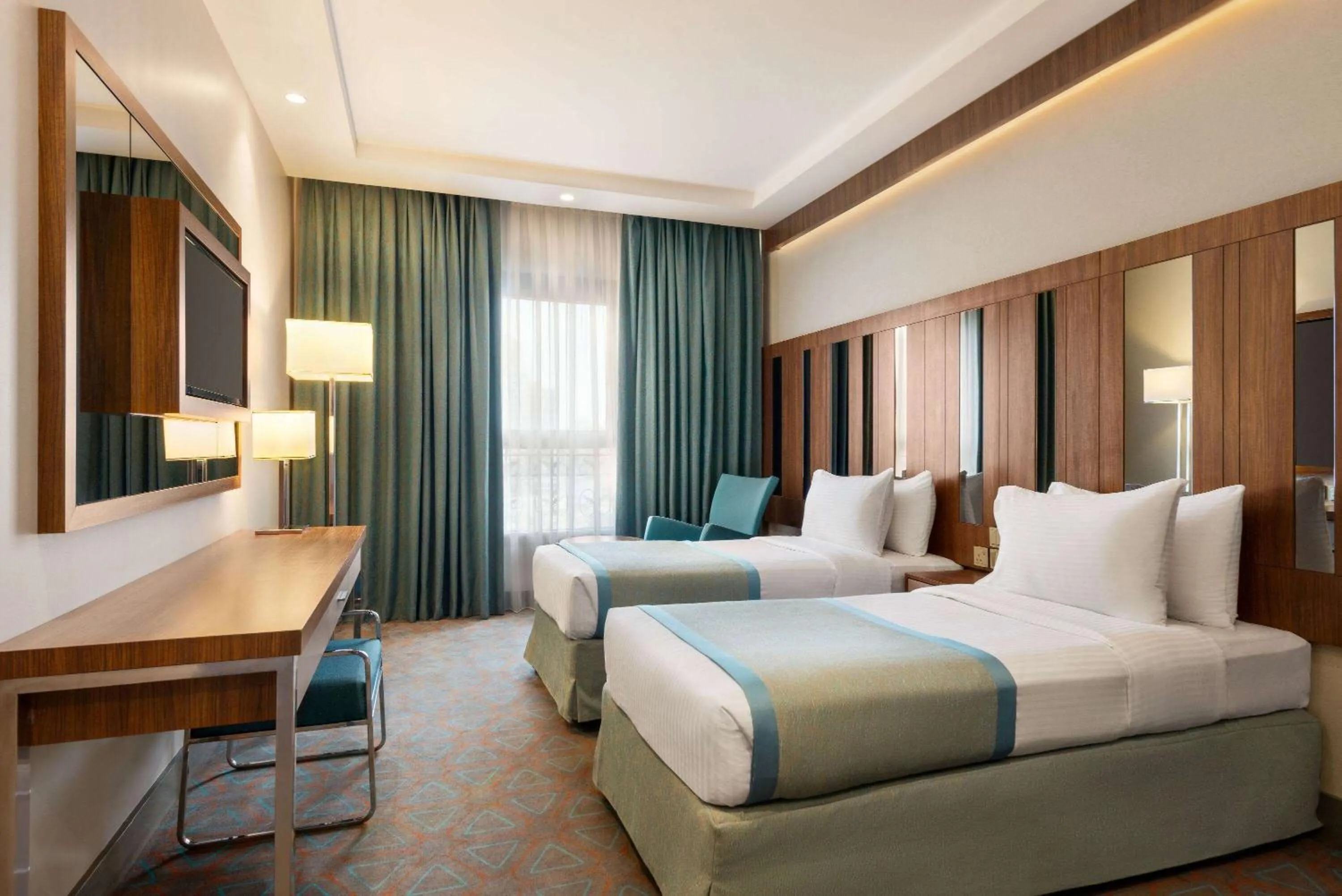 Photo of the whole room, Bed in Ramada by Wyndham Makkah Zad Al Tayseer