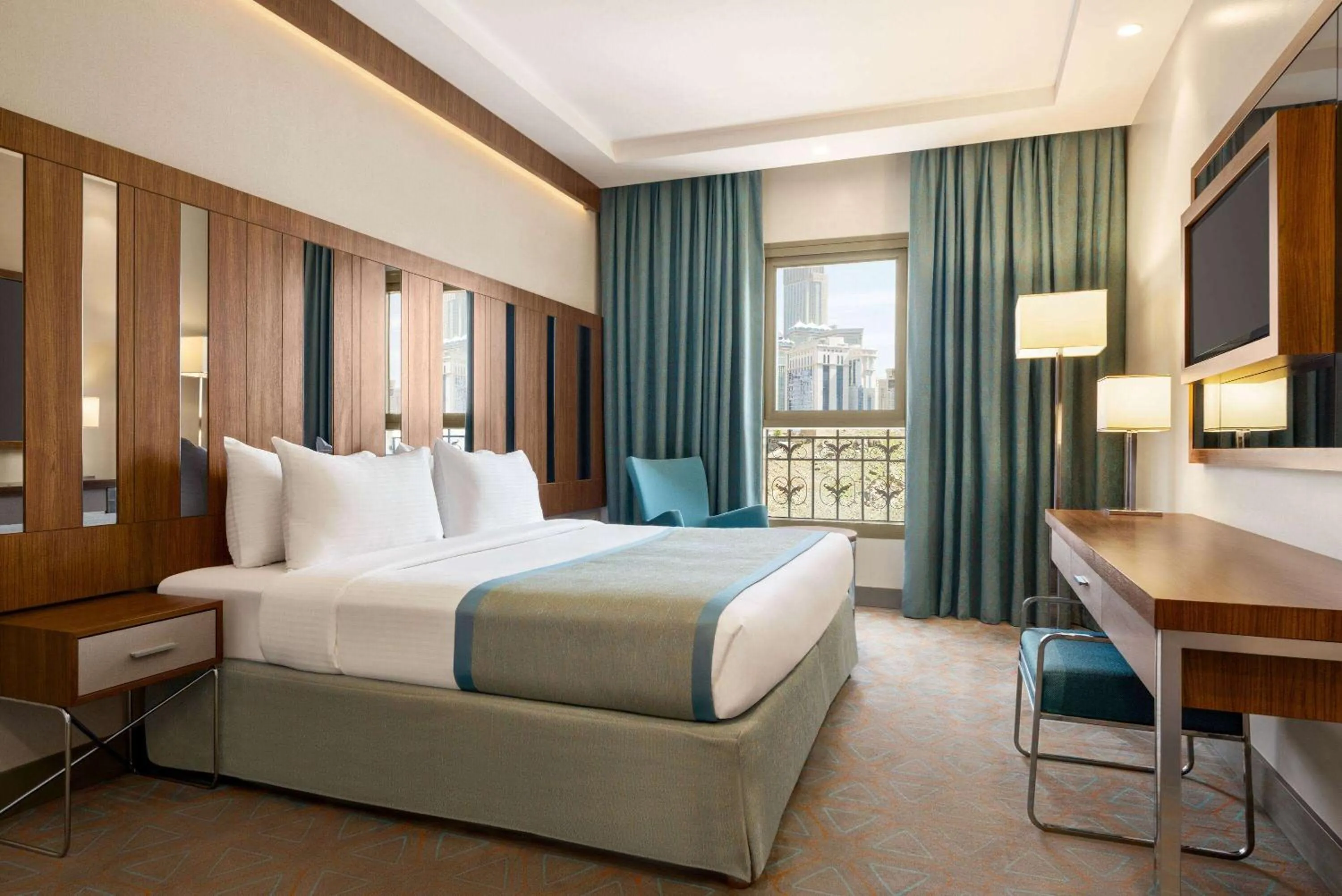 Photo of the whole room, Bed in Ramada by Wyndham Makkah Zad Al Tayseer