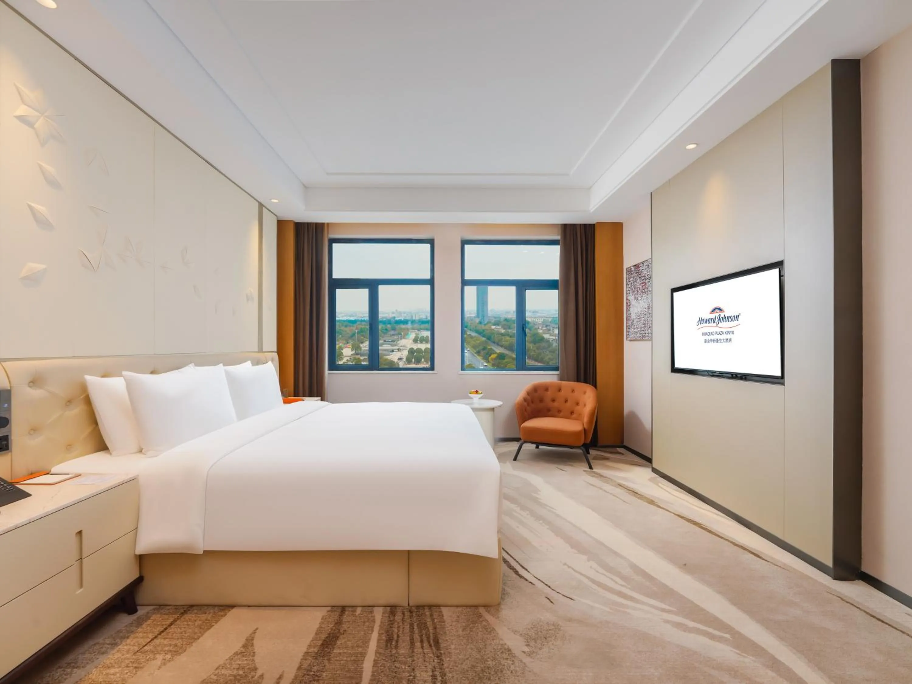 Bed in Howard Johnson by Wyndham Huaqiao Plaza Xinyu