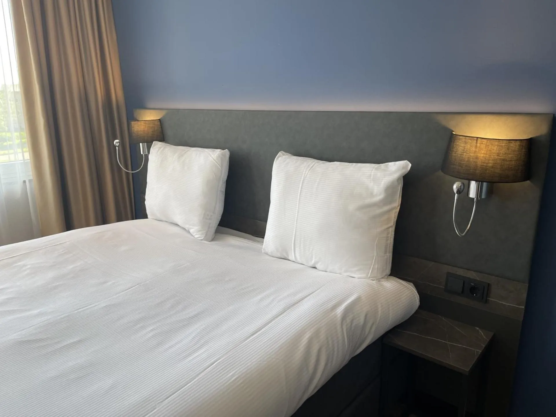 Bed in OZO Hotels Antares Airport