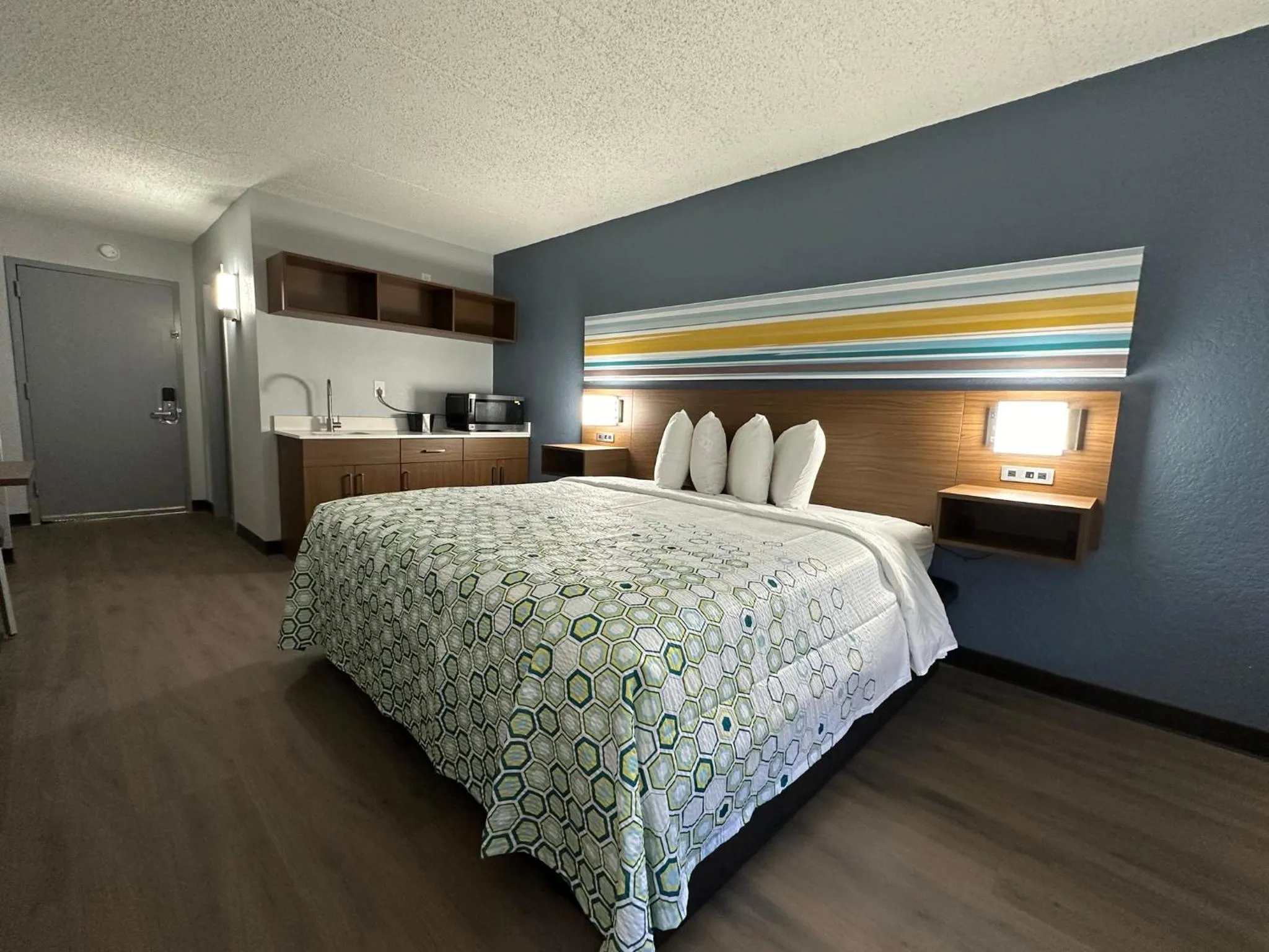 Bedroom, Bed in HomeTowne Studios by Red Roof Richmond, VA - W Broad St