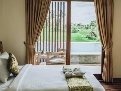 Bed in The Sawah Resort & Villa
