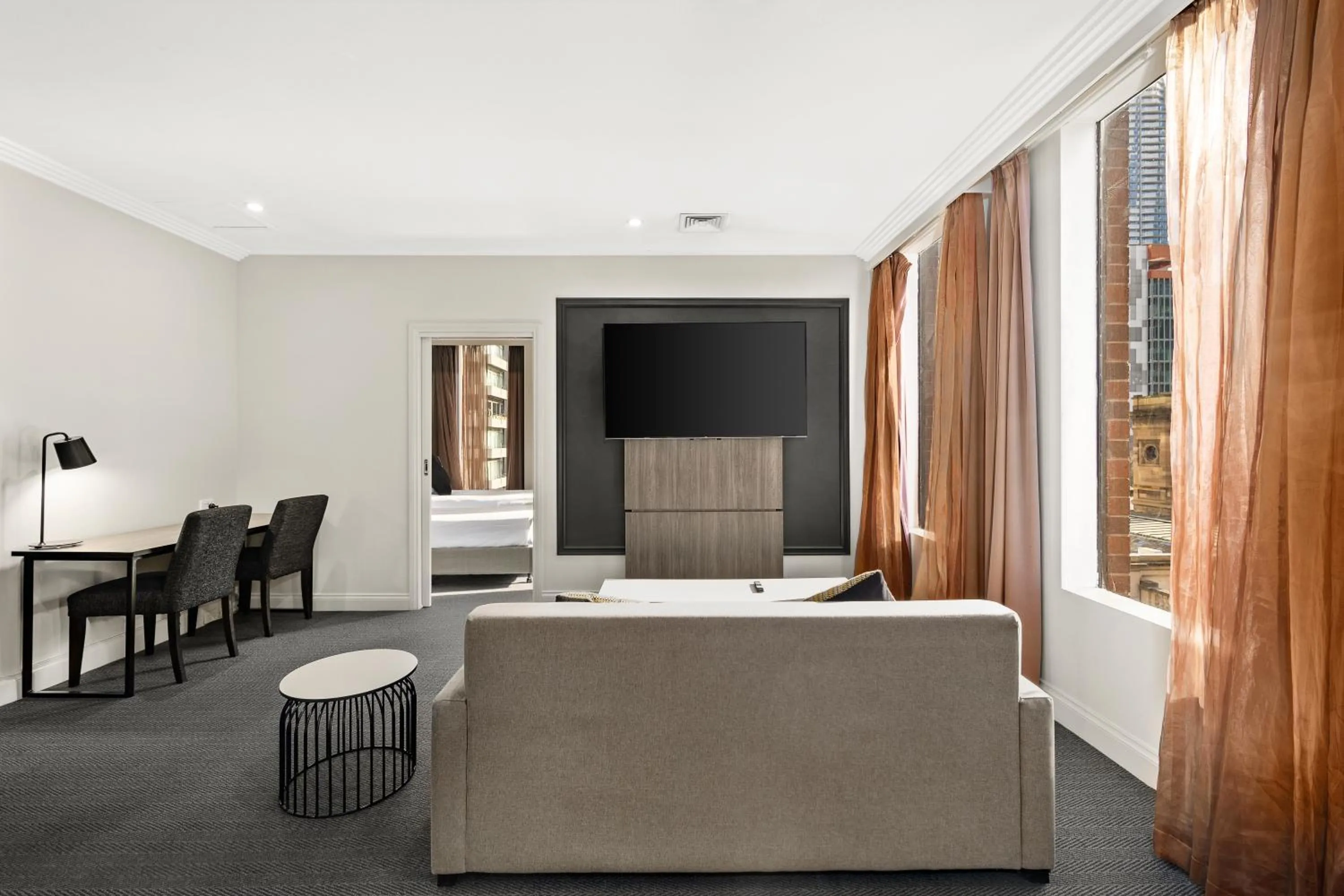 Living room, Bed in Melbourne City Suites