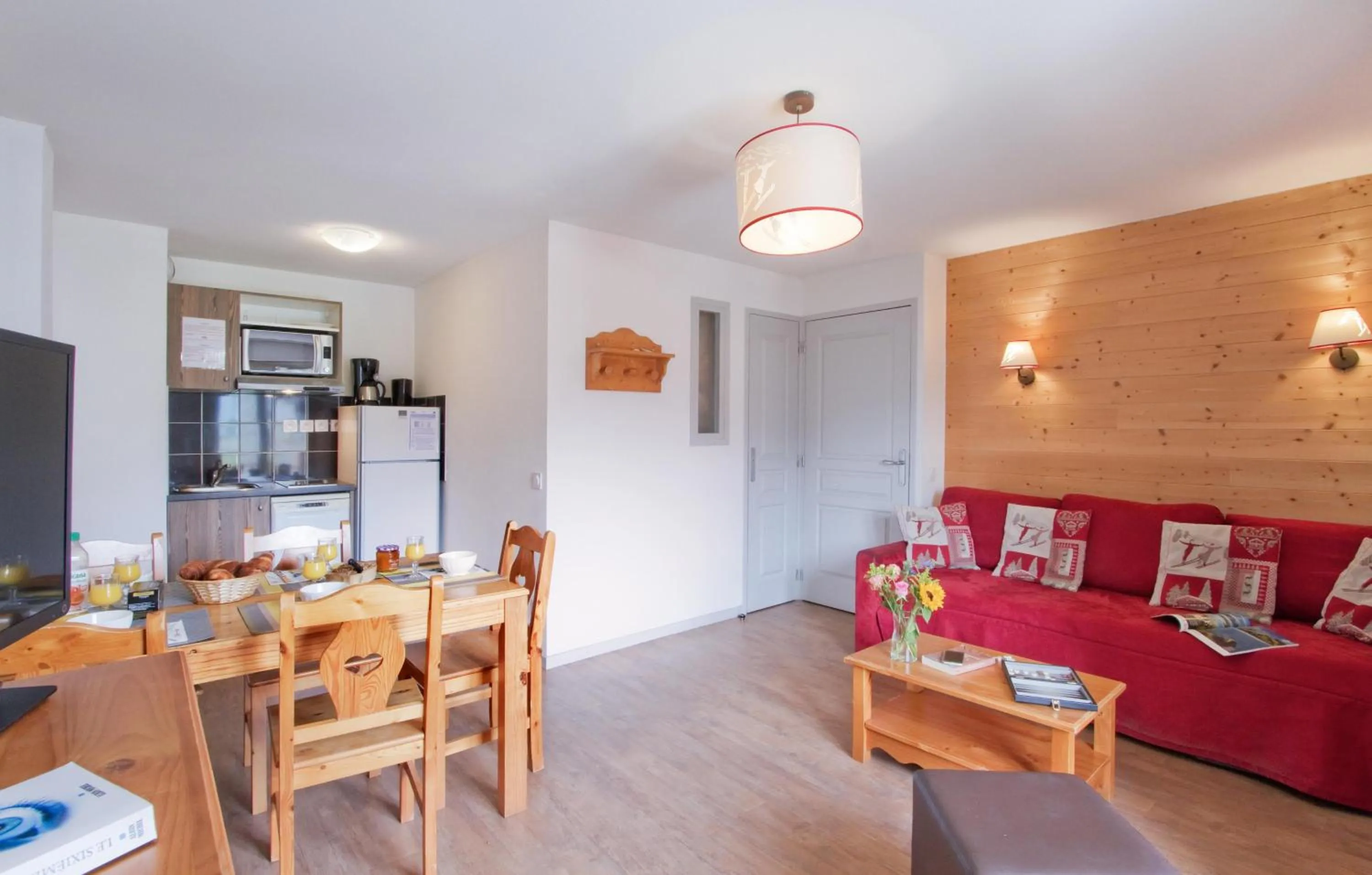 Kitchen or kitchenette in Résidence Odalys L'Ours Blanc