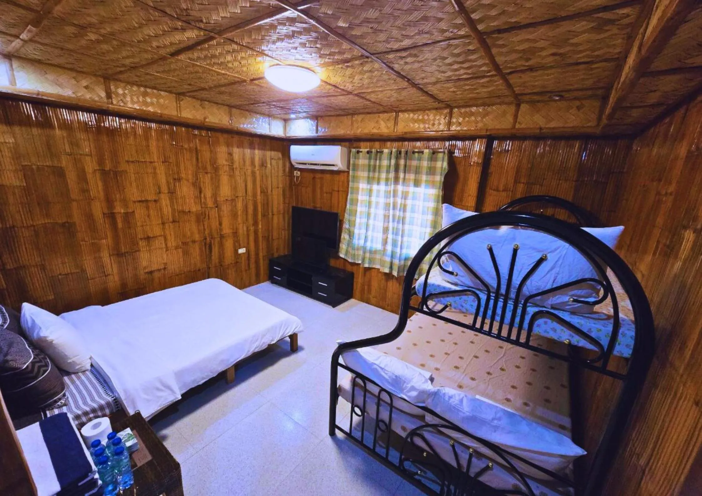 Bed in The Blessed Purple Bamboo Beach Resort