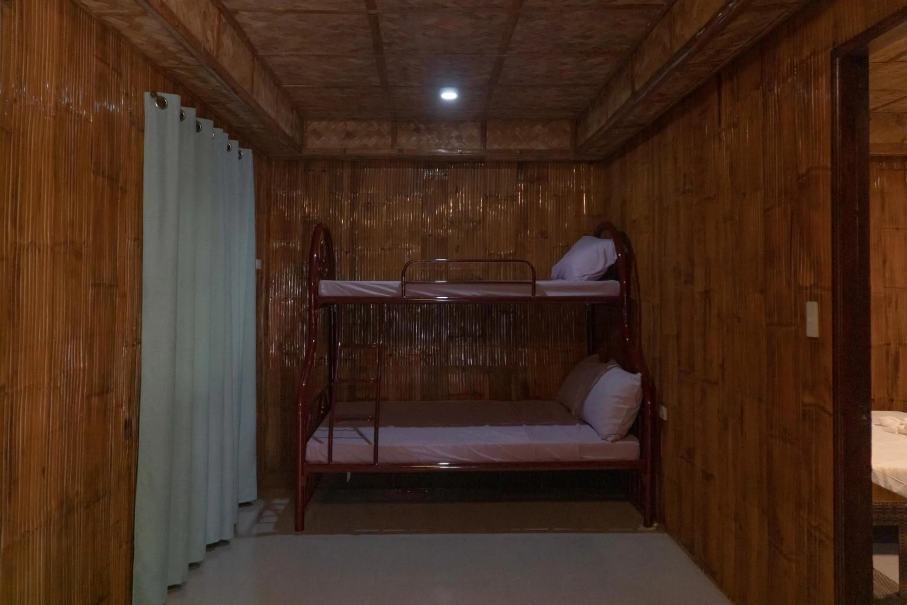 Bed in The Blessed Purple Bamboo Beach Resort