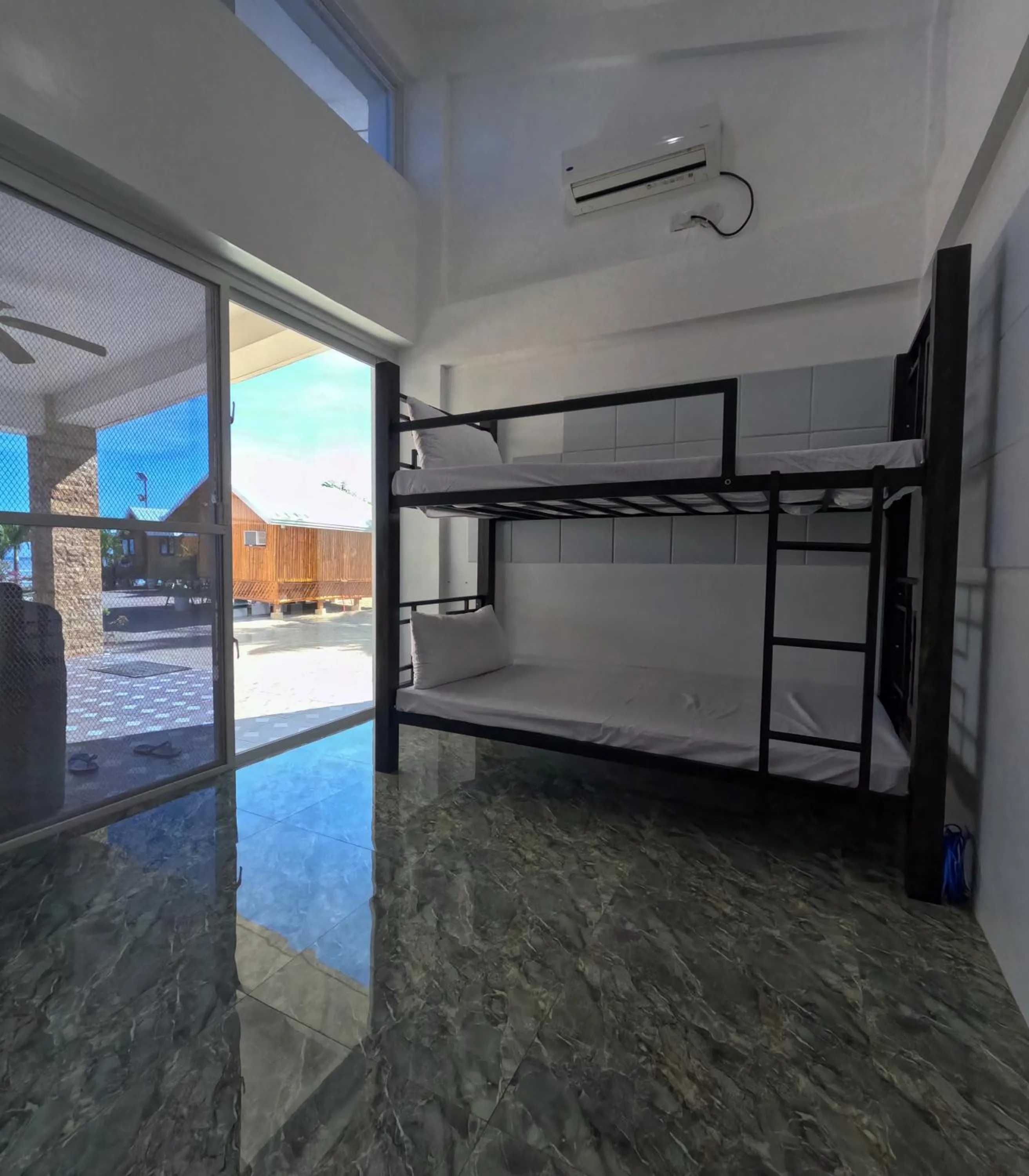 Bed in The Blessed Purple Bamboo Beach Resort