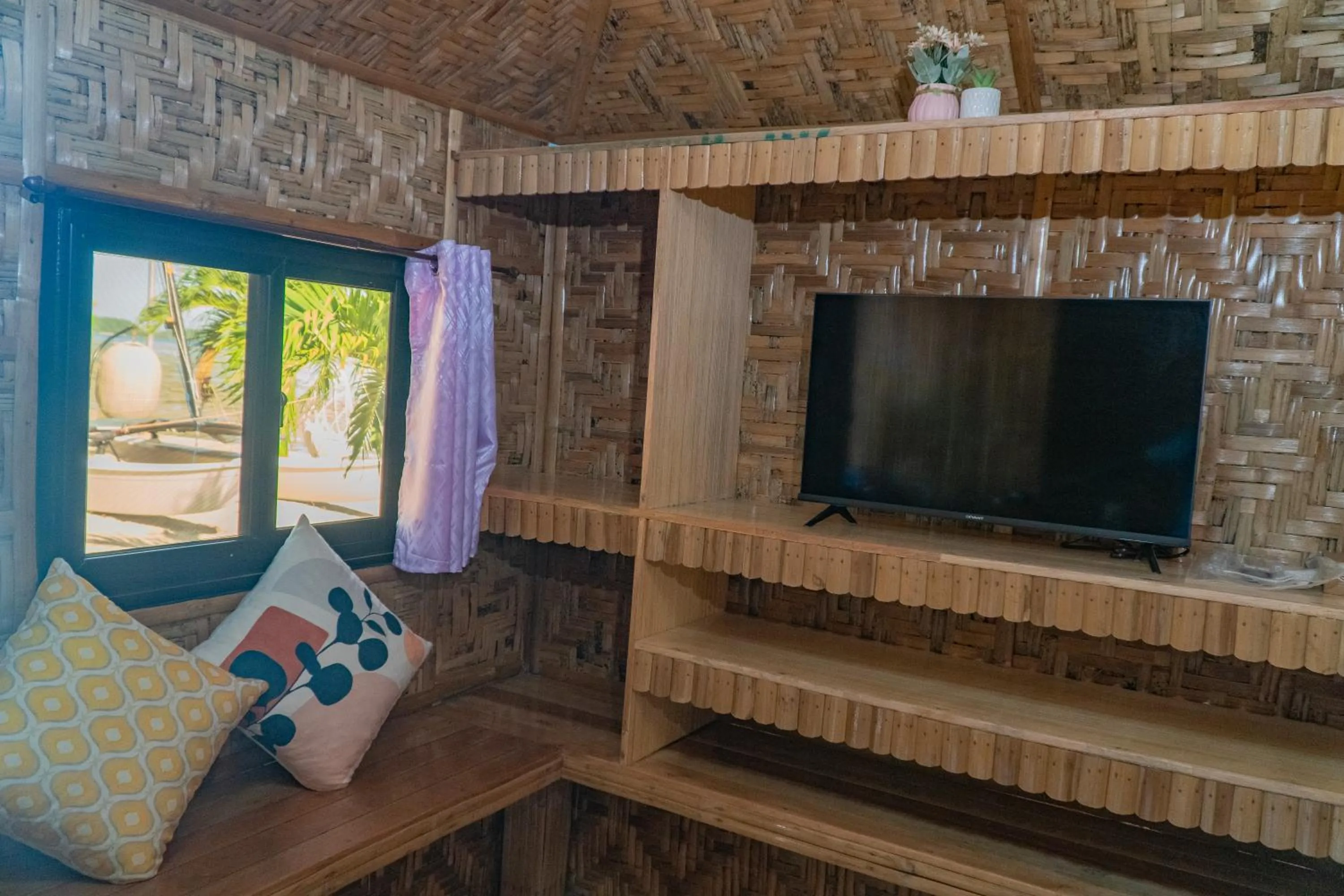 Bed in The Blessed Purple Bamboo Beach Resort