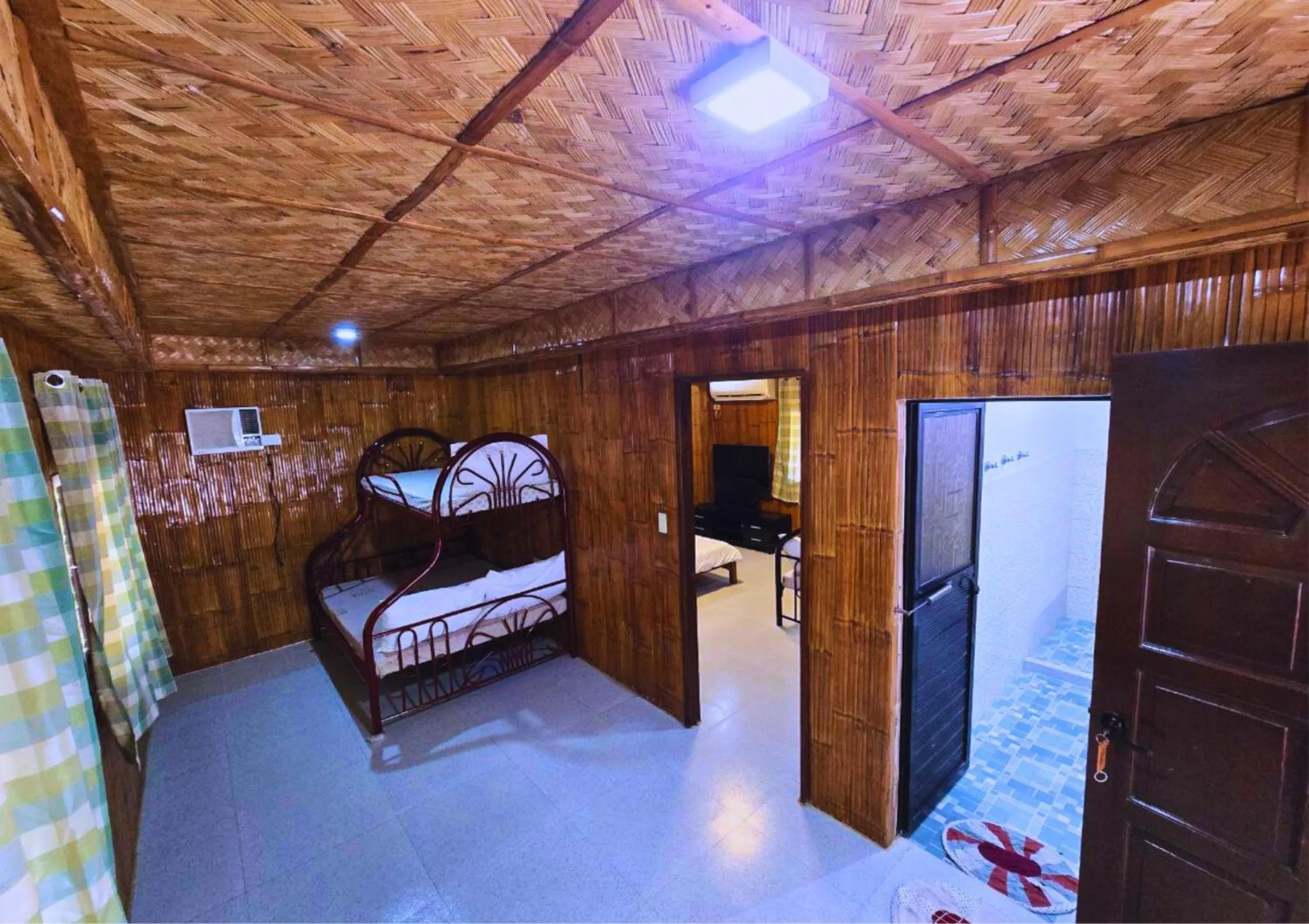 Bed in The Blessed Purple Bamboo Beach Resort