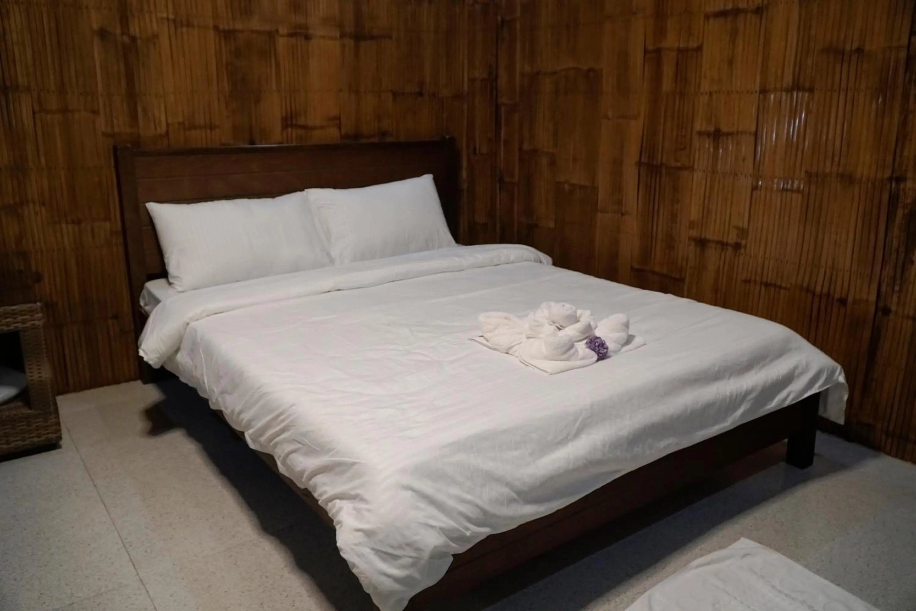 Bed in The Blessed Purple Bamboo Beach Resort