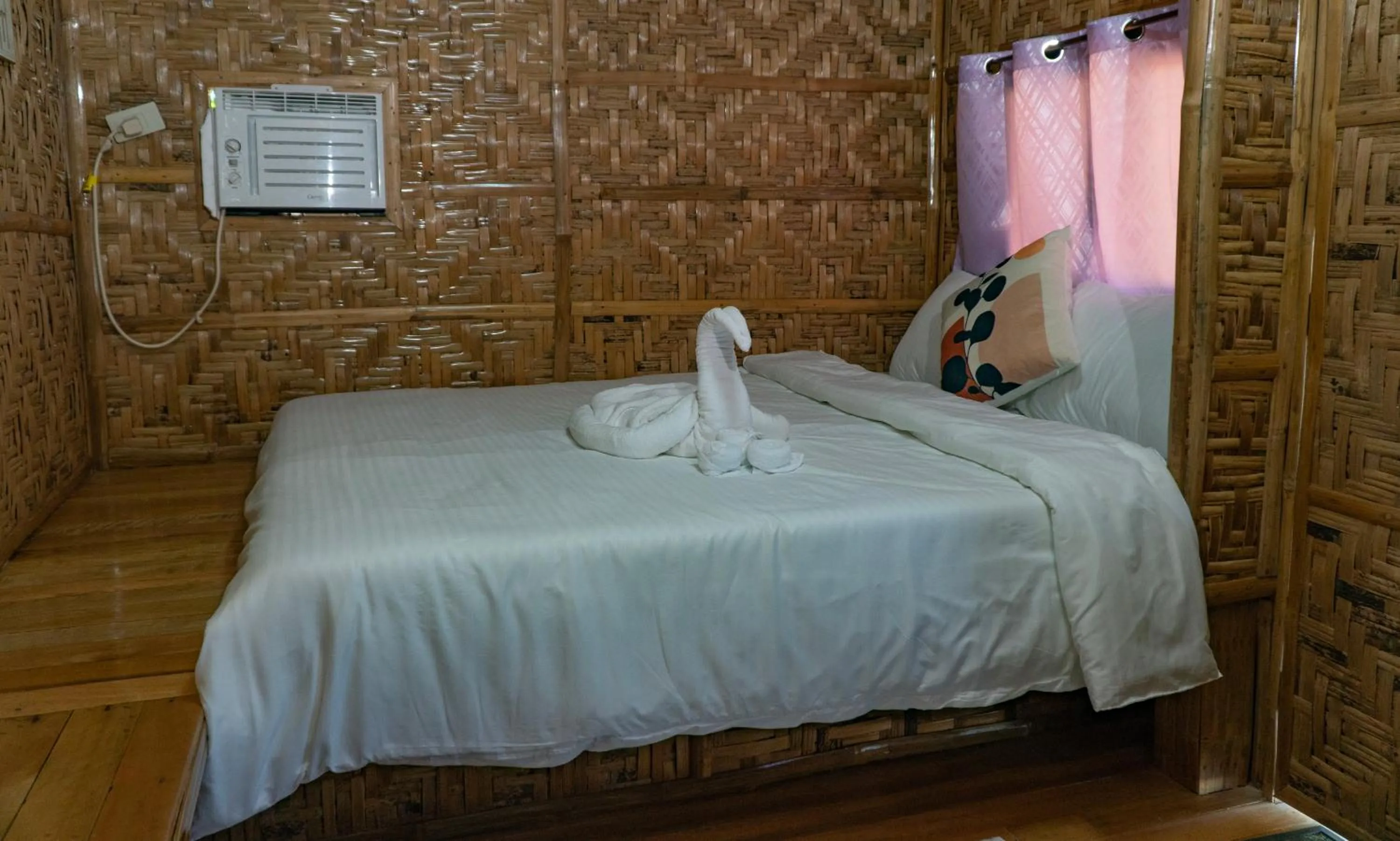 Bed in The Blessed Purple Bamboo Beach Resort