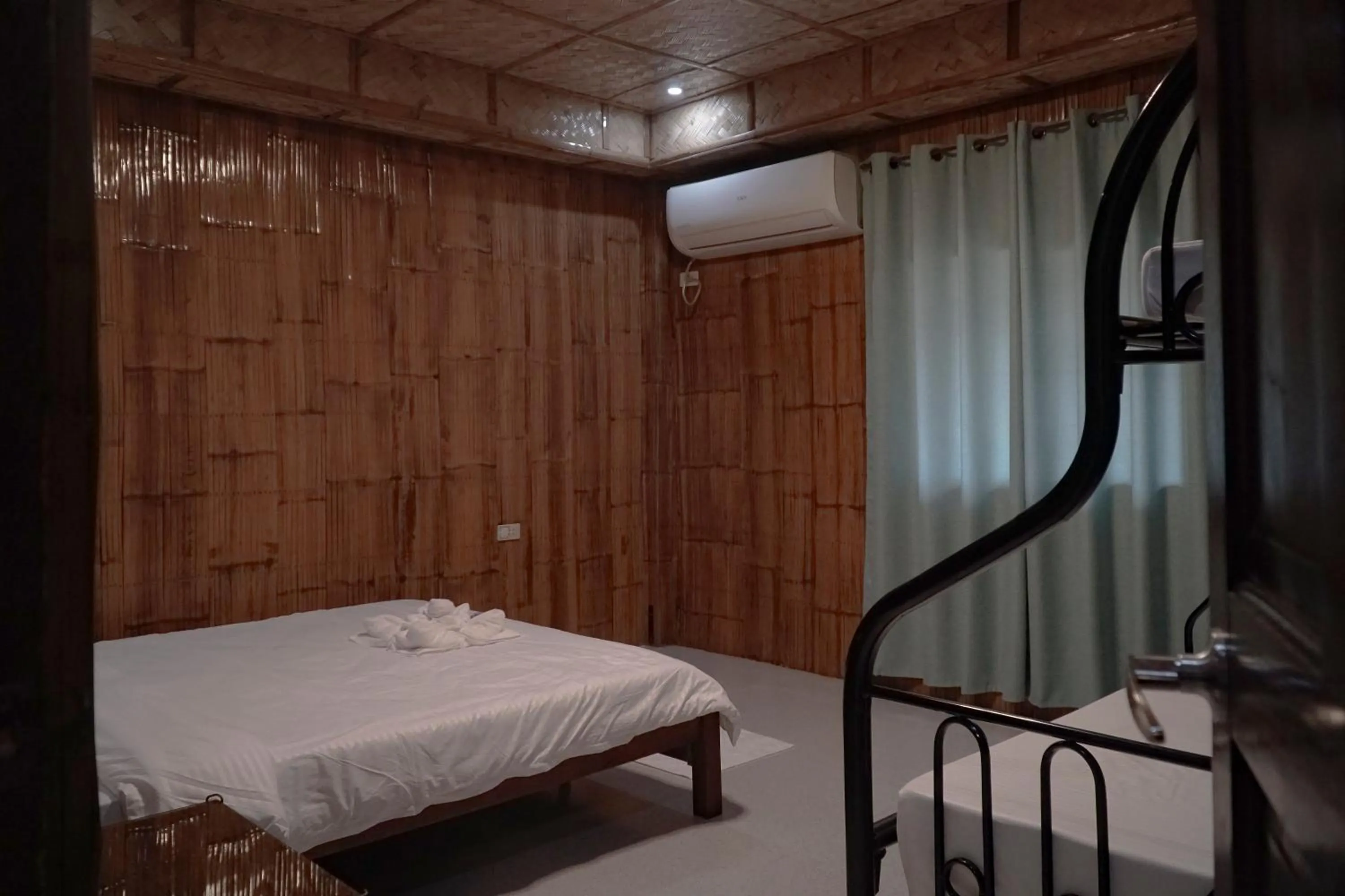 Bed in The Blessed Purple Bamboo Beach Resort