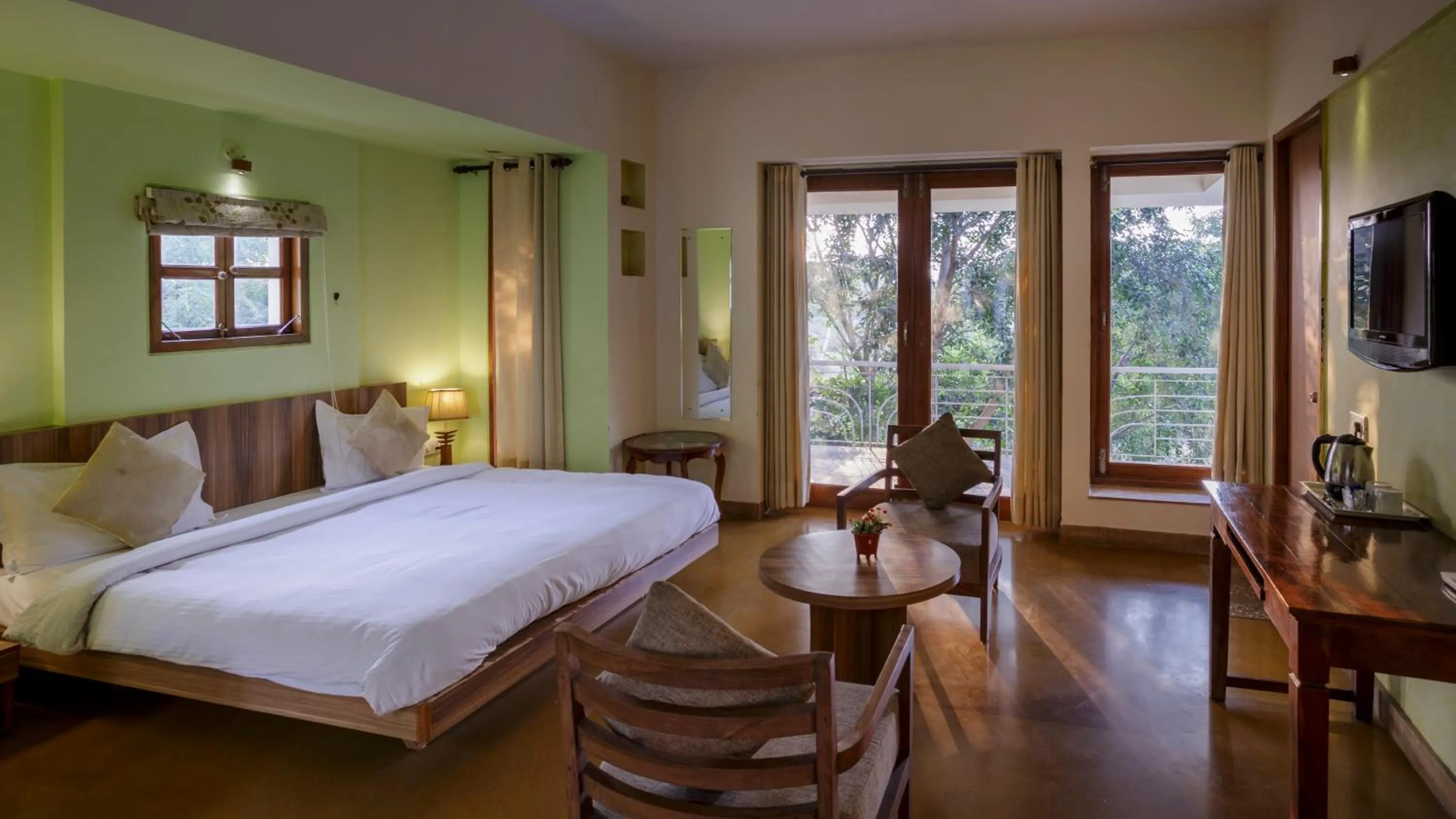 Communal lounge/ TV room, Bed in The Chitvan Resort