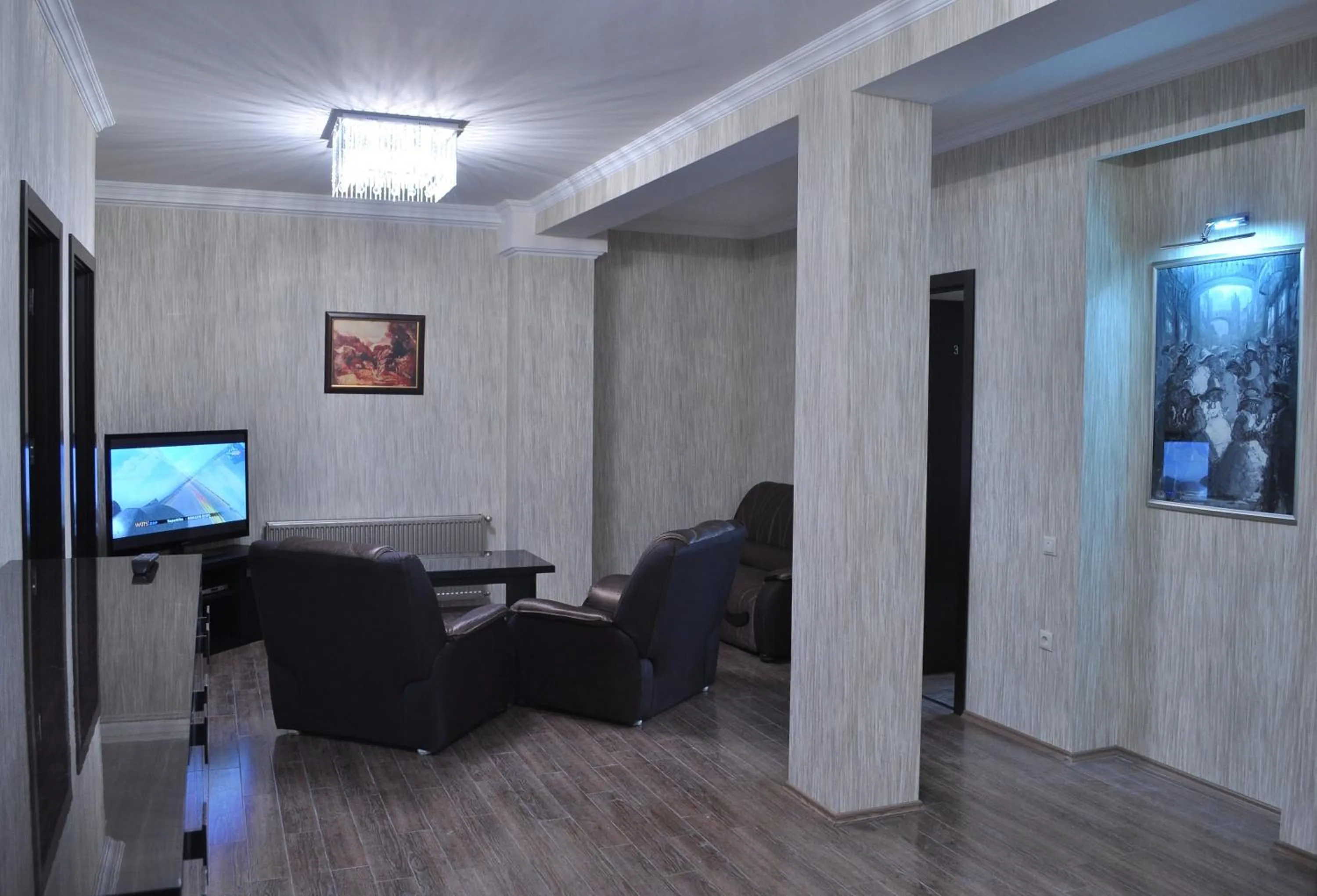 Communal lounge/ TV room in Rondo Hotel