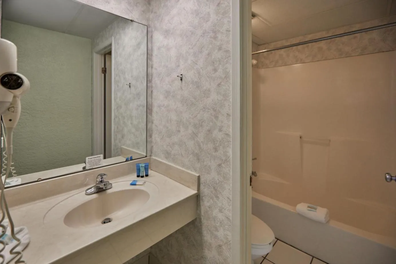 Shower in Palmetto Beachfront Hotel, a By The Sea Resort