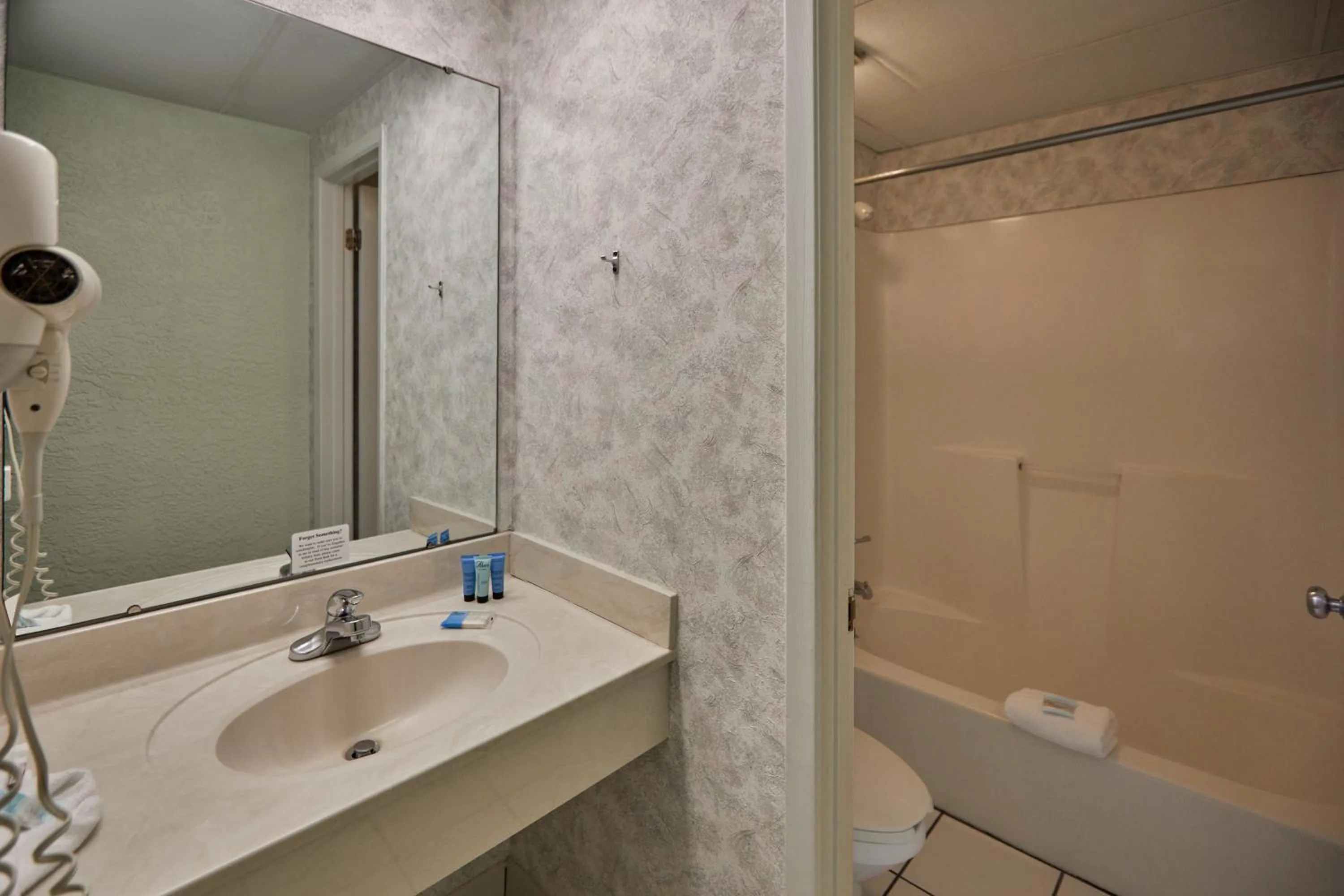 Shower in Palmetto Beachfront Hotel, a By The Sea Resort