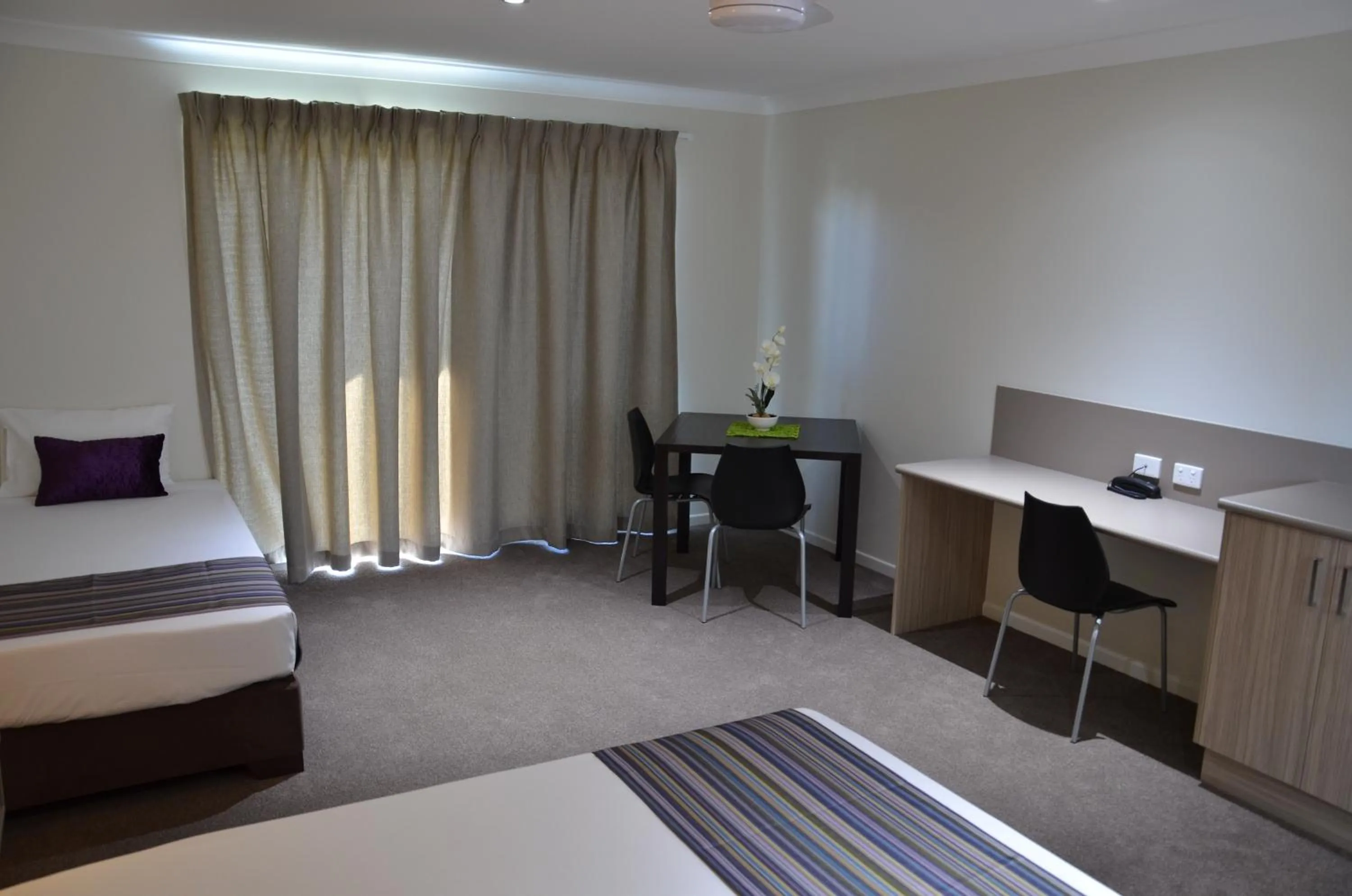 Bed in Beachside Boutique Motel Mackay