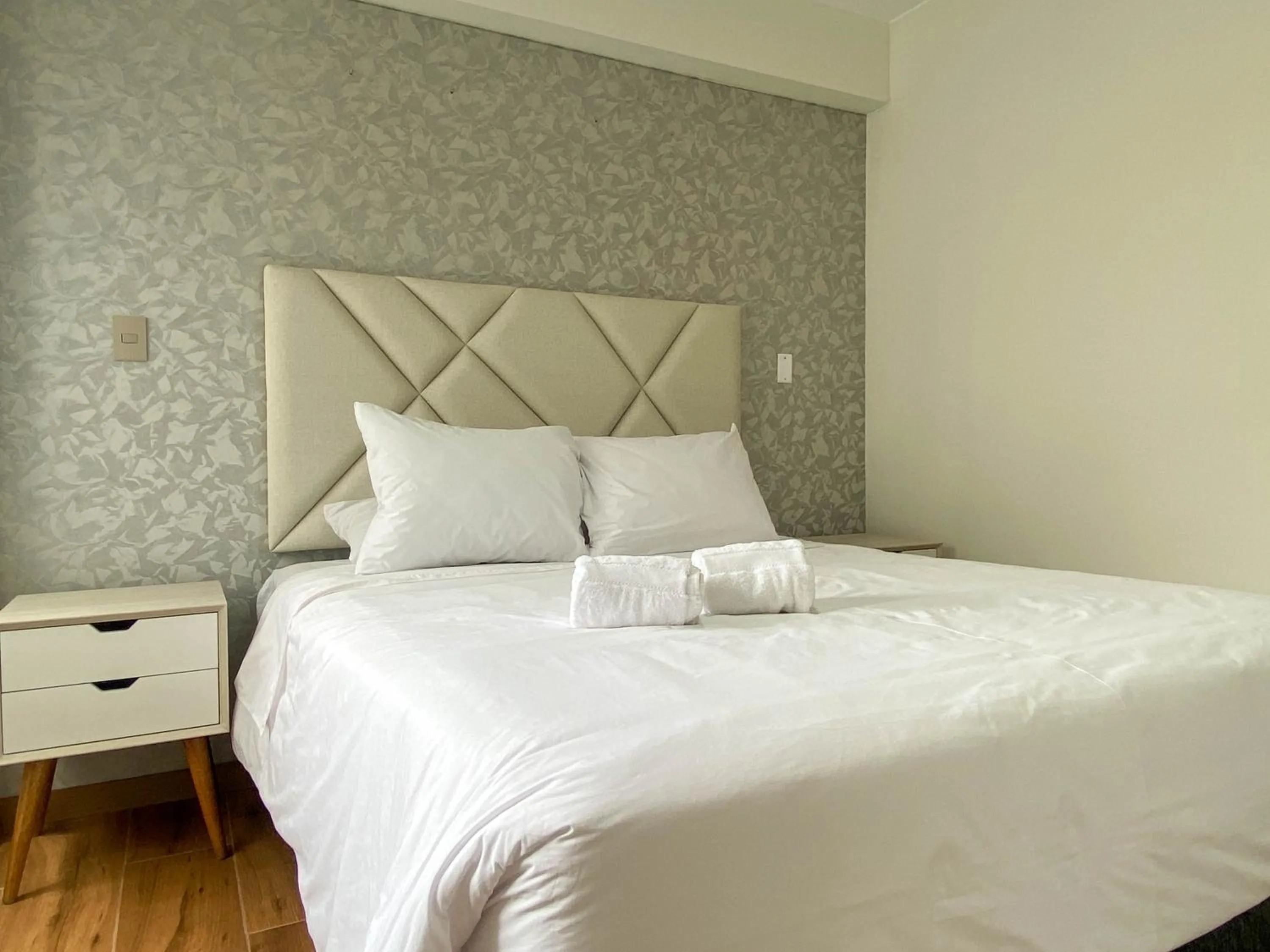 Photo of the whole room, Bed in Borgoño By Wynwood House