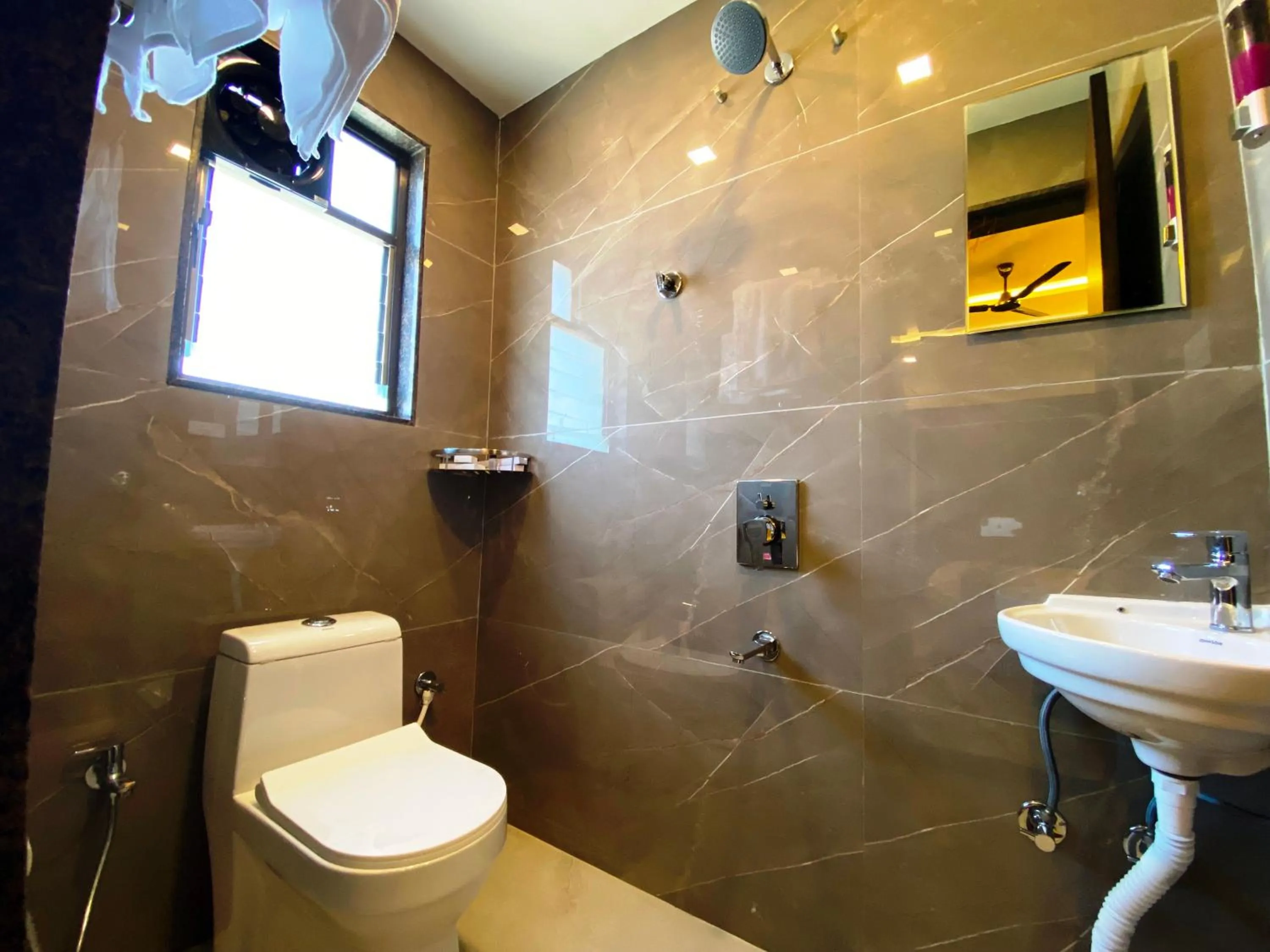 Bathroom in The Grand Sarovar Inn And Suites