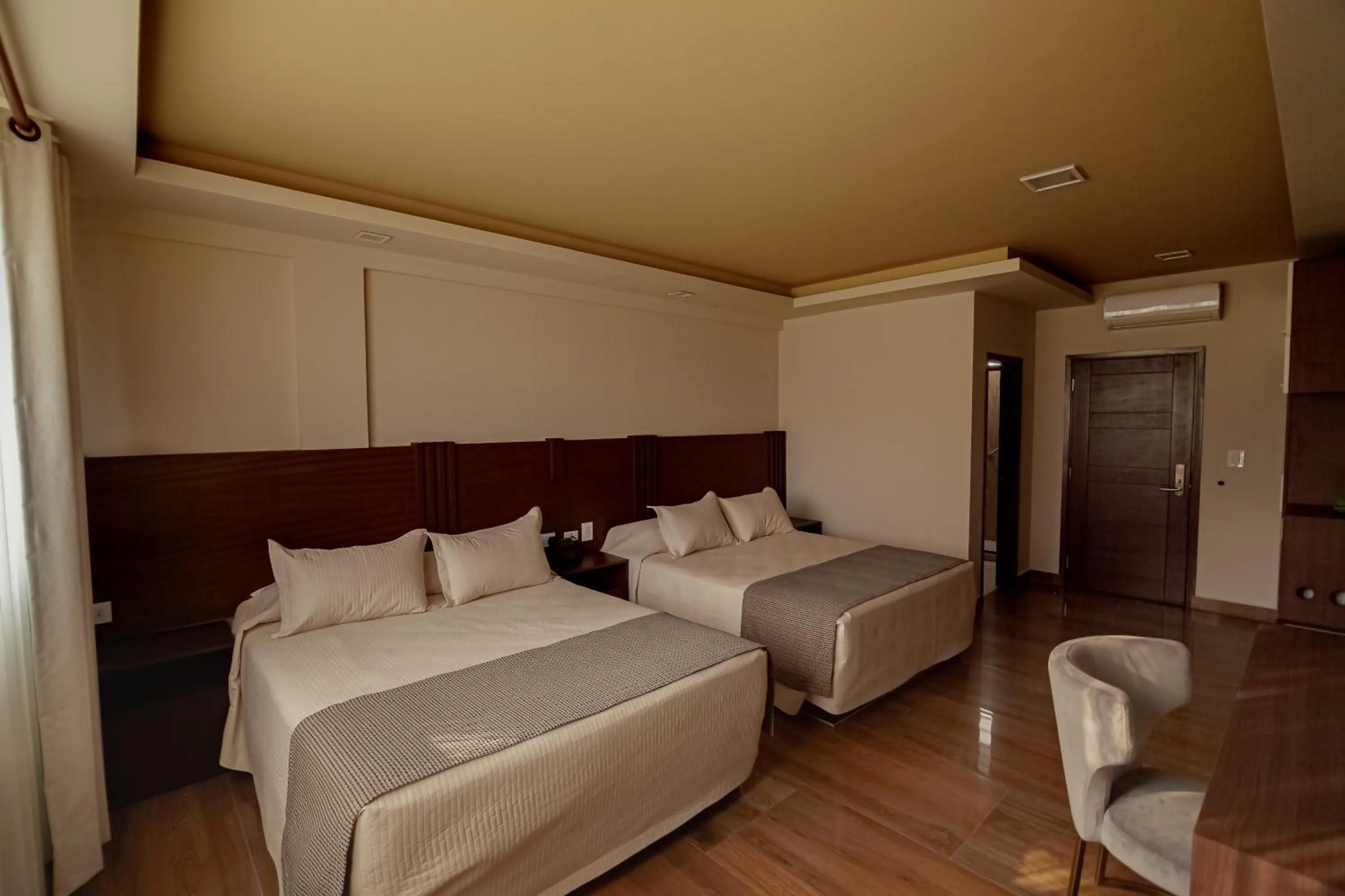 Photo of the whole room, Bed in Hotel Sirari By Regina