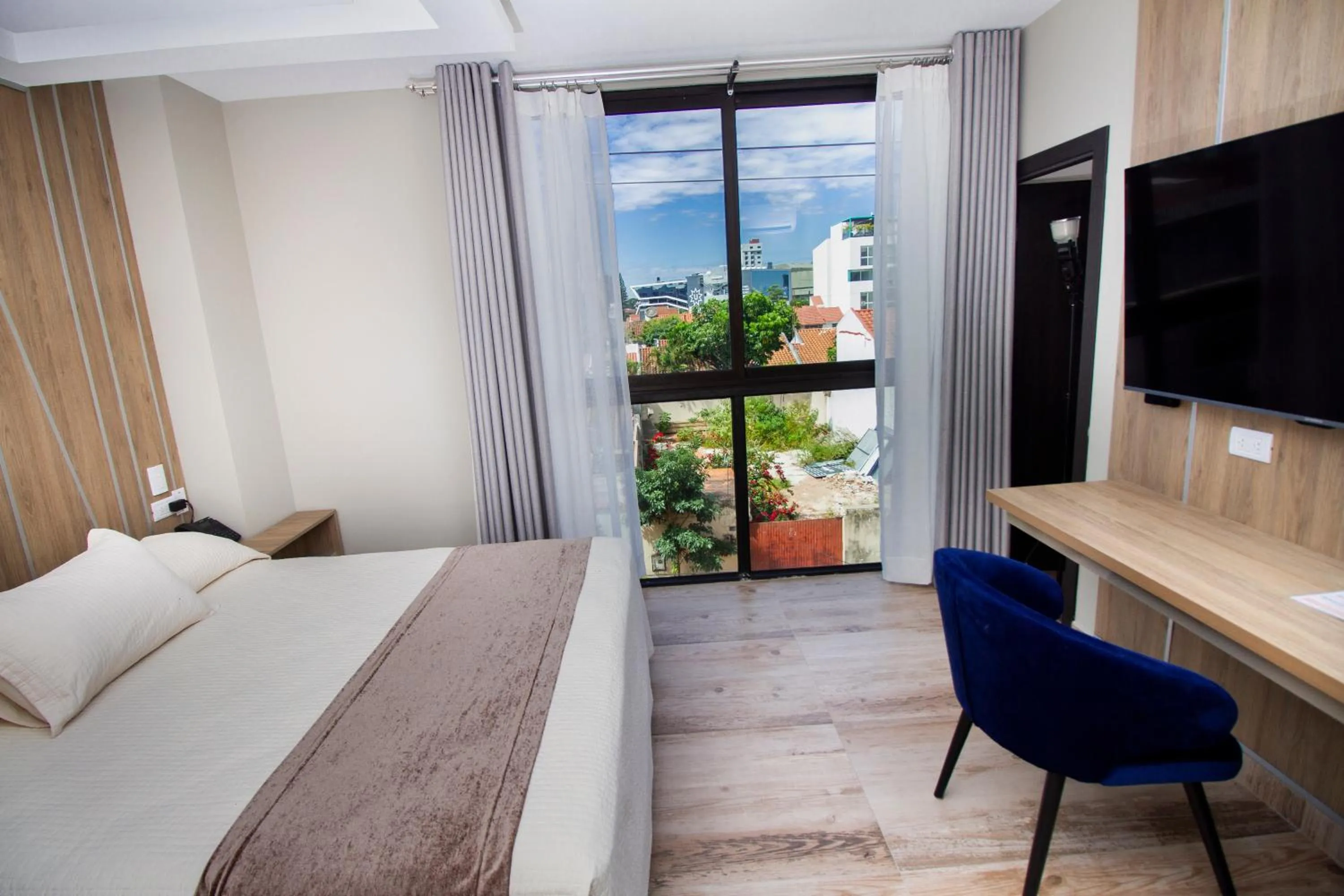 Photo of the whole room, Bed in Hotel Sirari By Regina