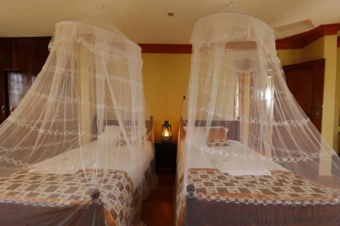 Bed in Top of the World Lodges Fort Portal