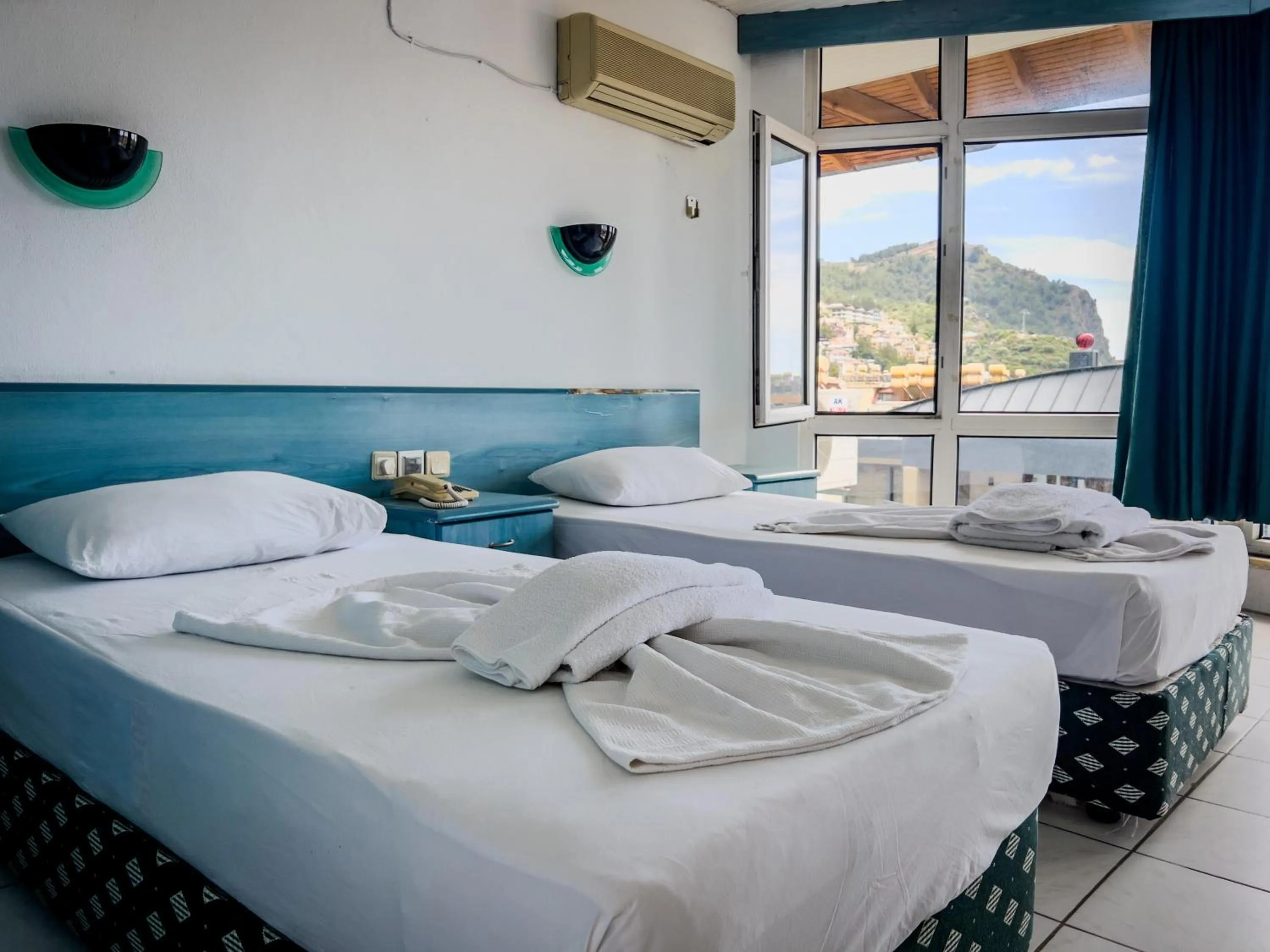 Bed in Casa Cleo Suit Hotel