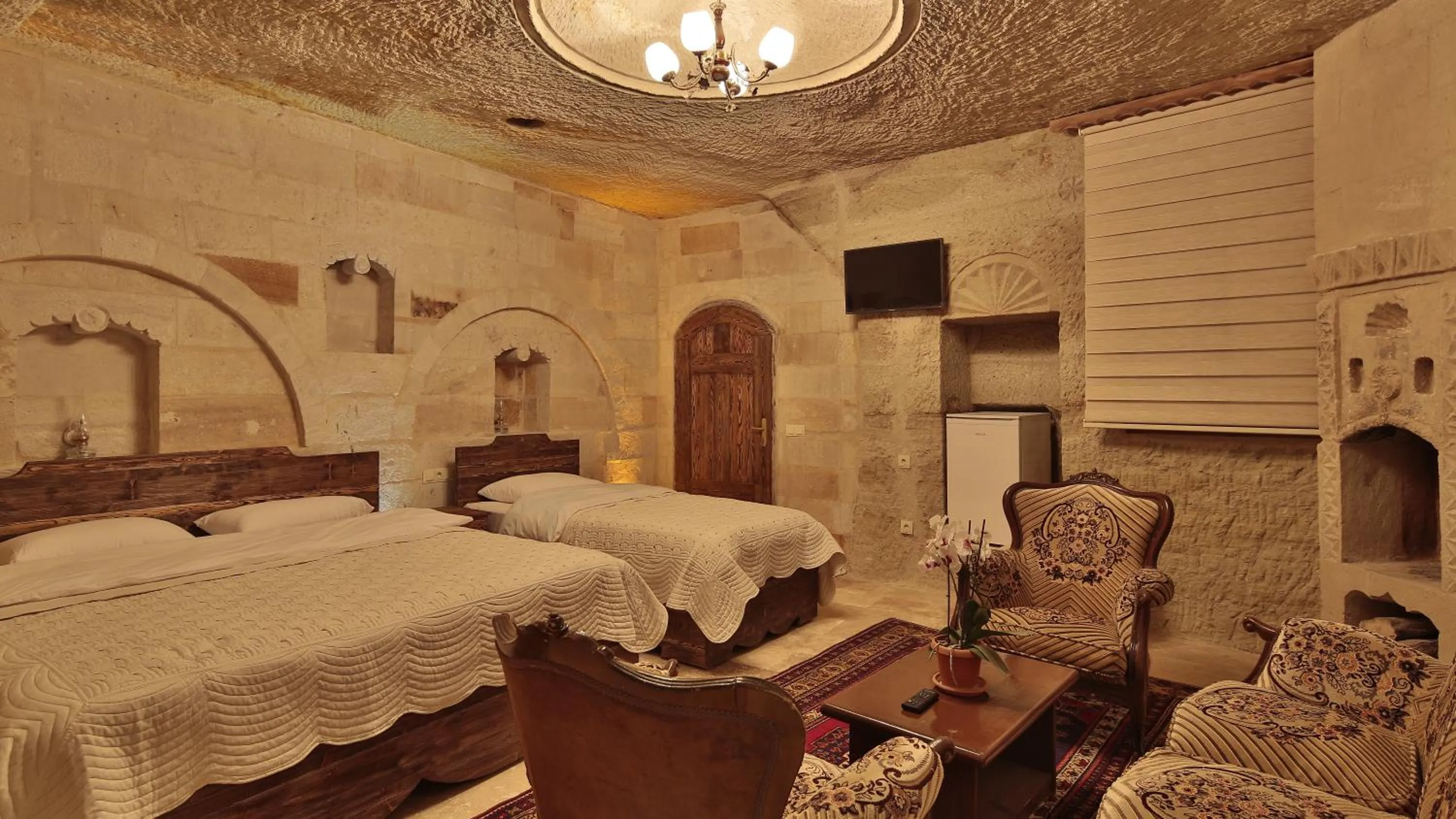 Bedroom, Bed in Family Cave Suite Hotel