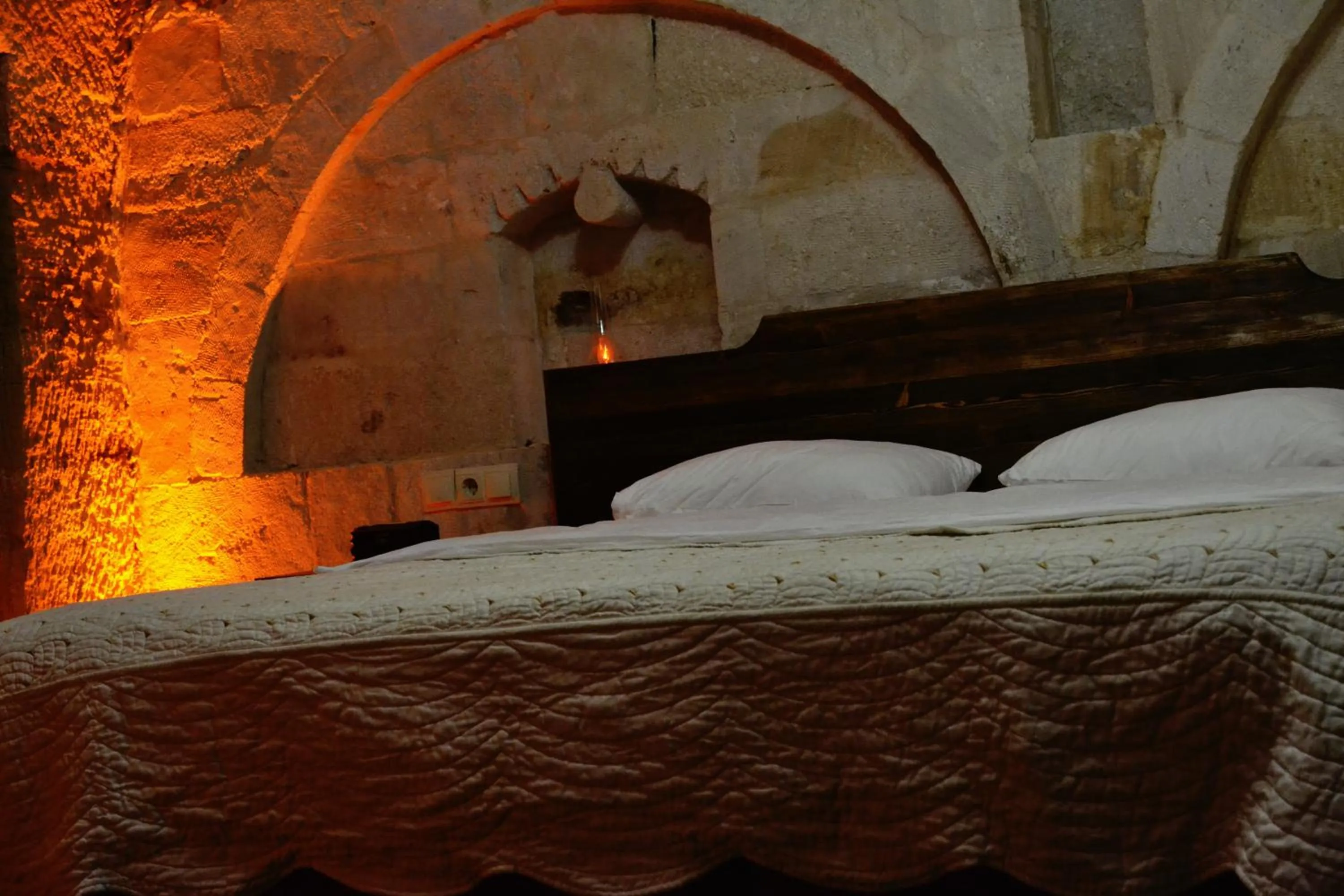 Bed in Family Cave Suite Hotel