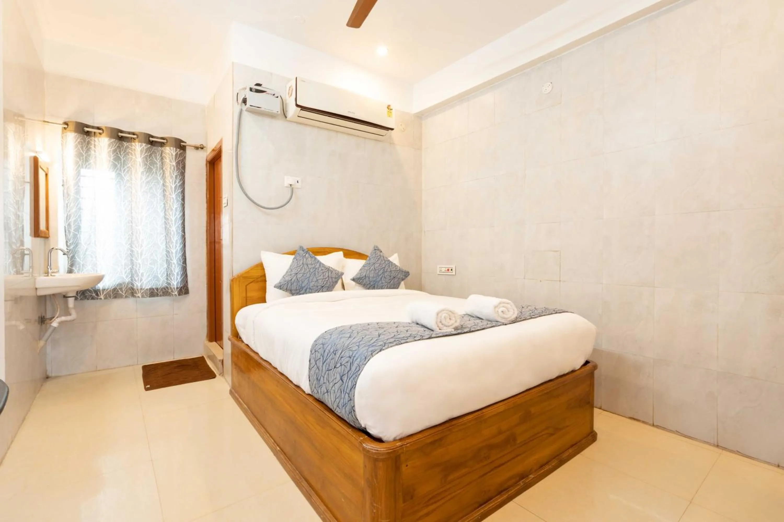 Bed in Hotel Arya Grand Rameswaram by Nimalan