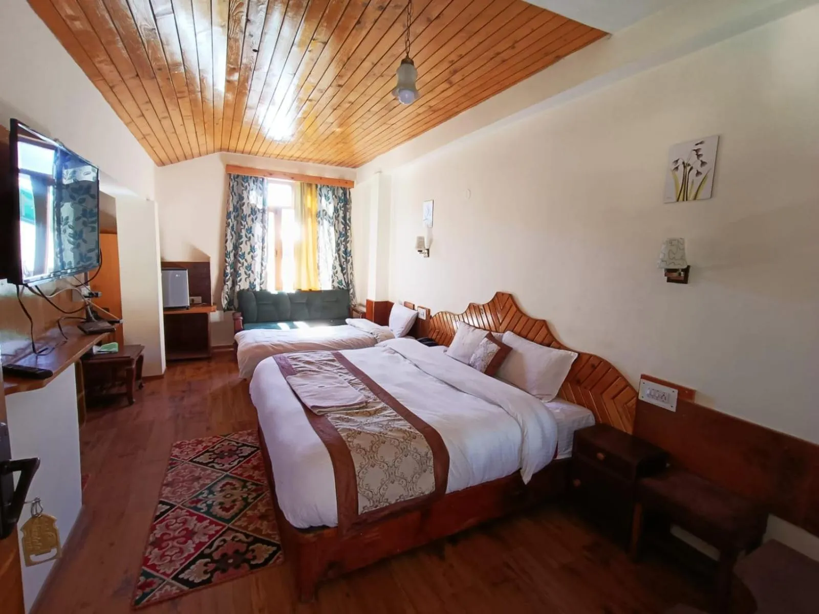 Bed in CS Shhandella Hotel