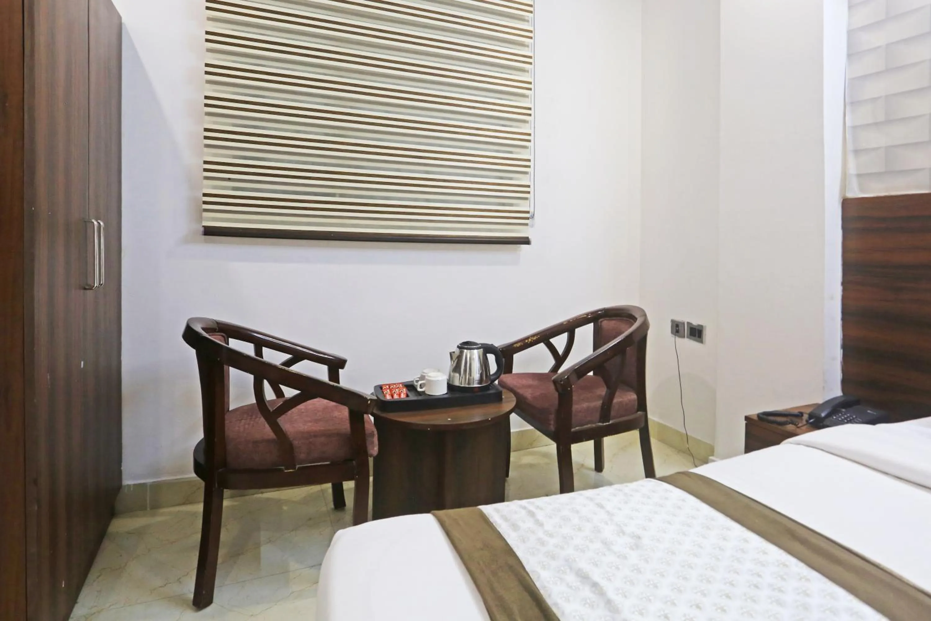 Seating area, Bed in Hotel ECG Grand Inn-Near Delhi Airport free Airport Drop