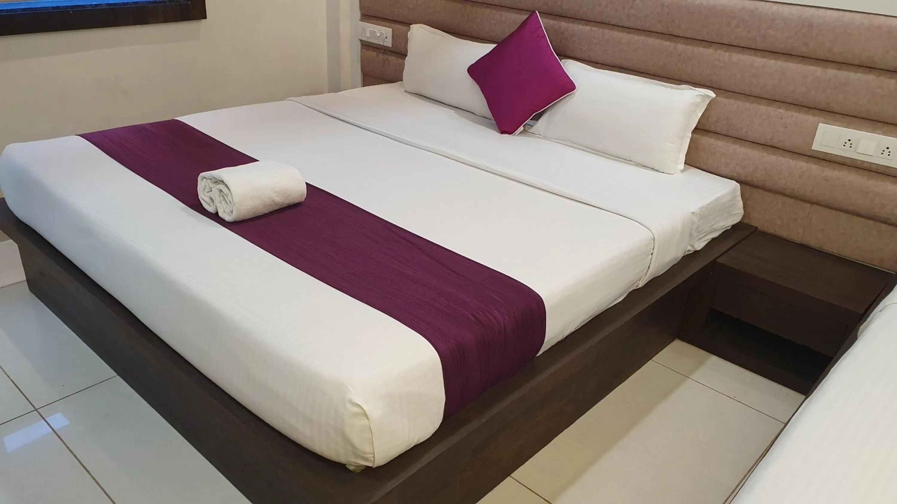 Bed in Hotel Siddhali Inn