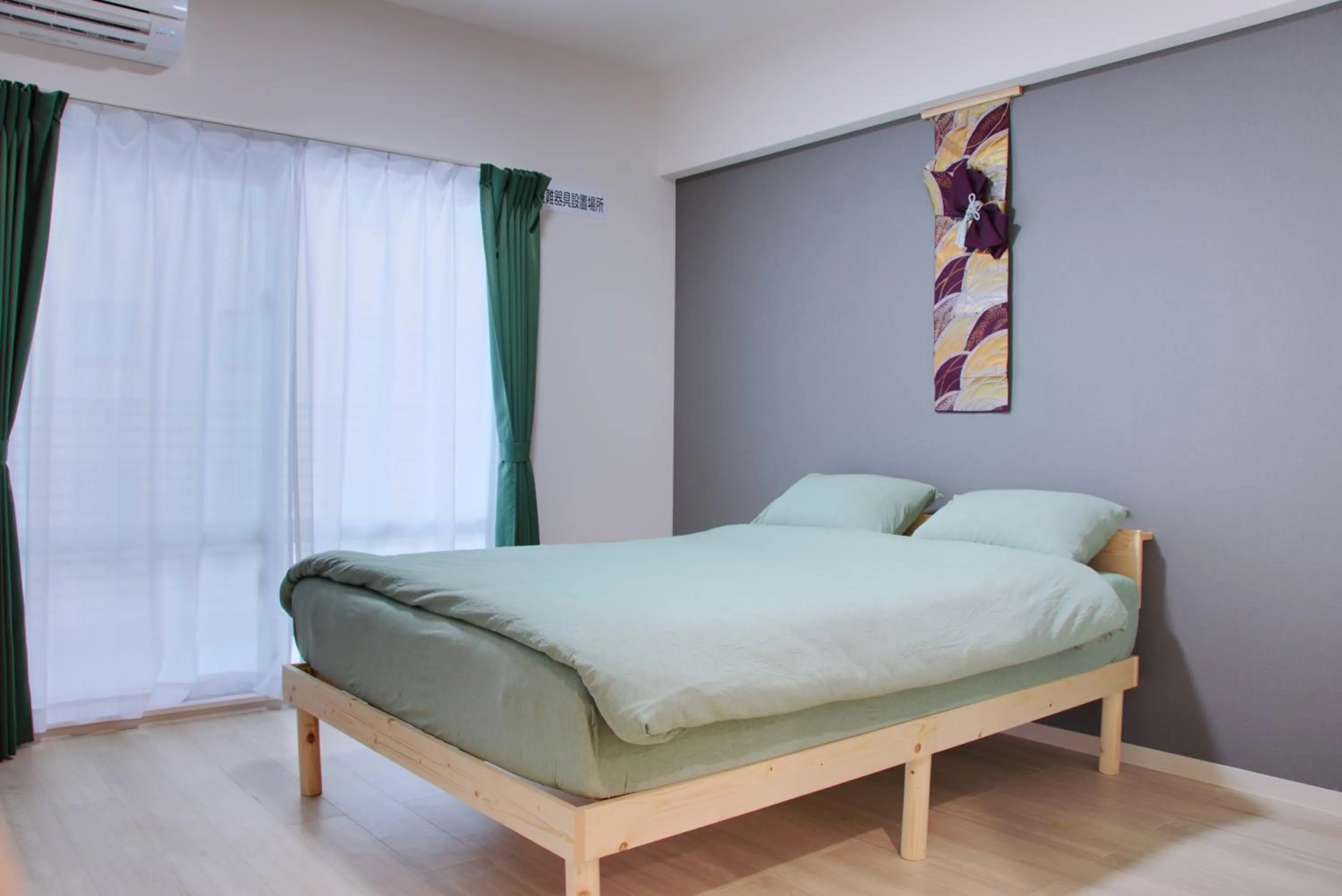 Bed in Island Stay Izumizaki Hotel