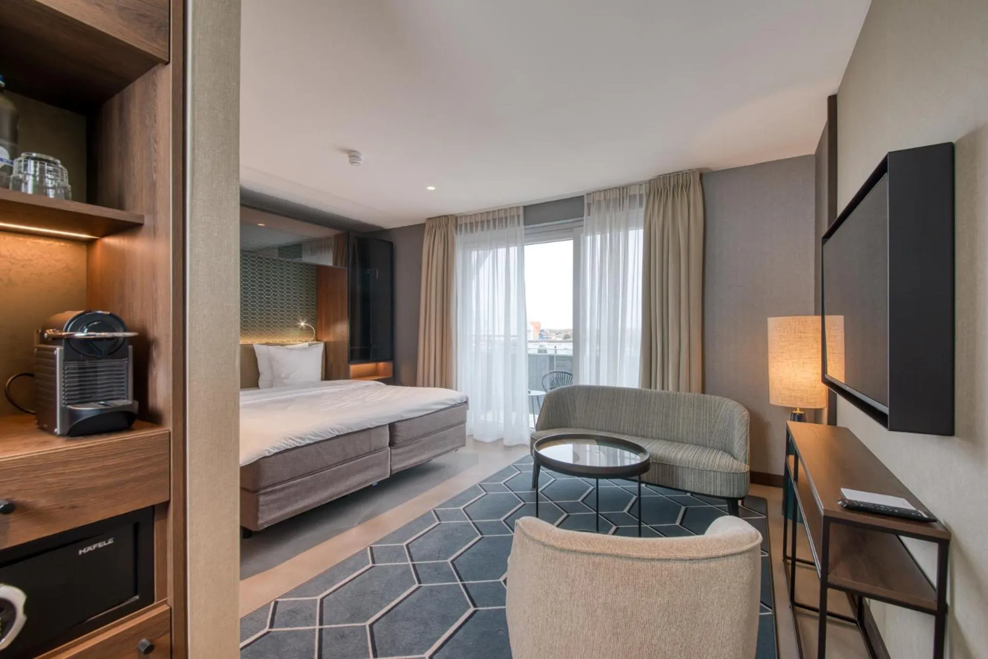 Seating area, Bed in Hotel de Schelde