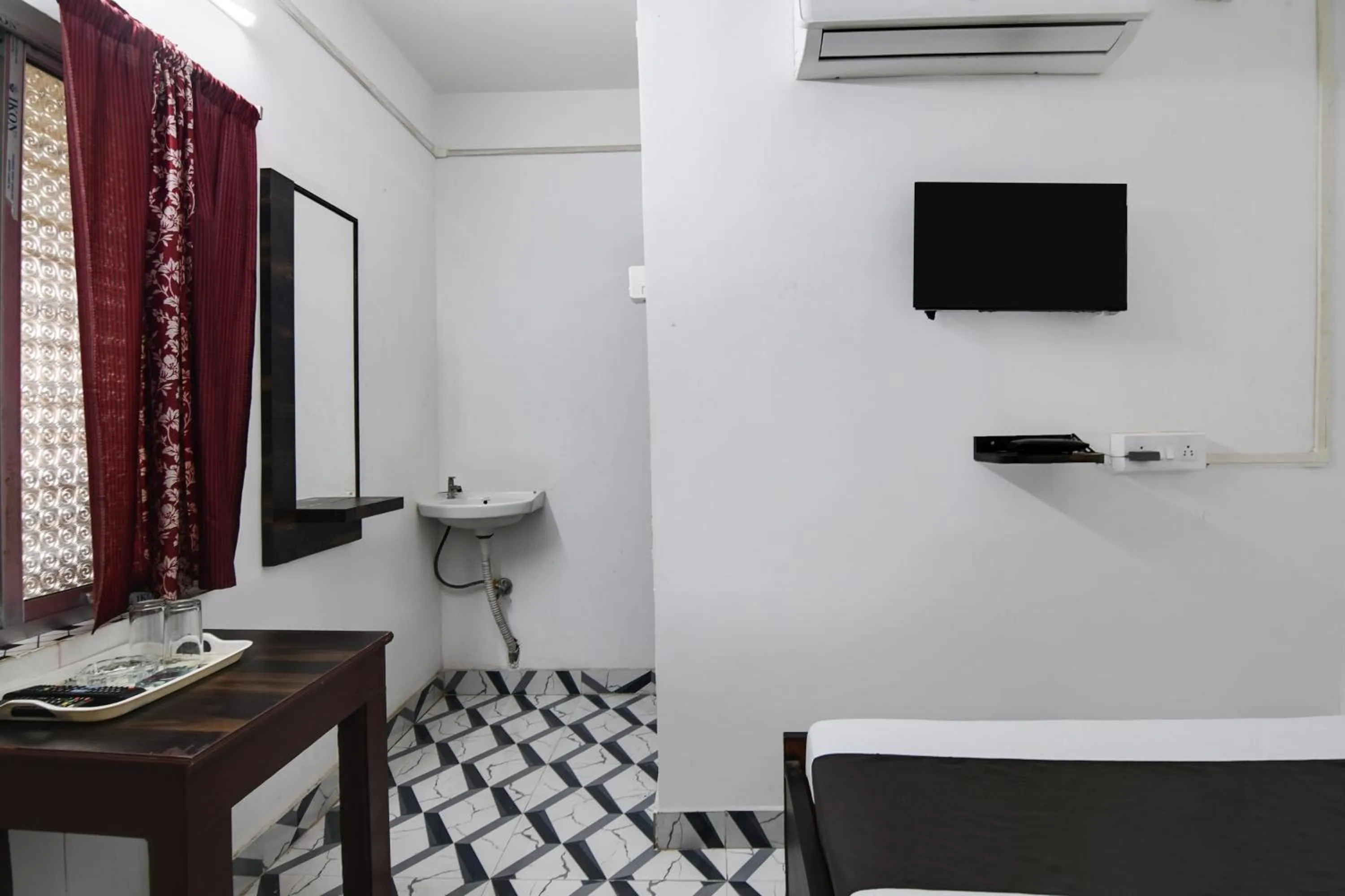 Bedroom in Hotel O PPS NEST Guest House