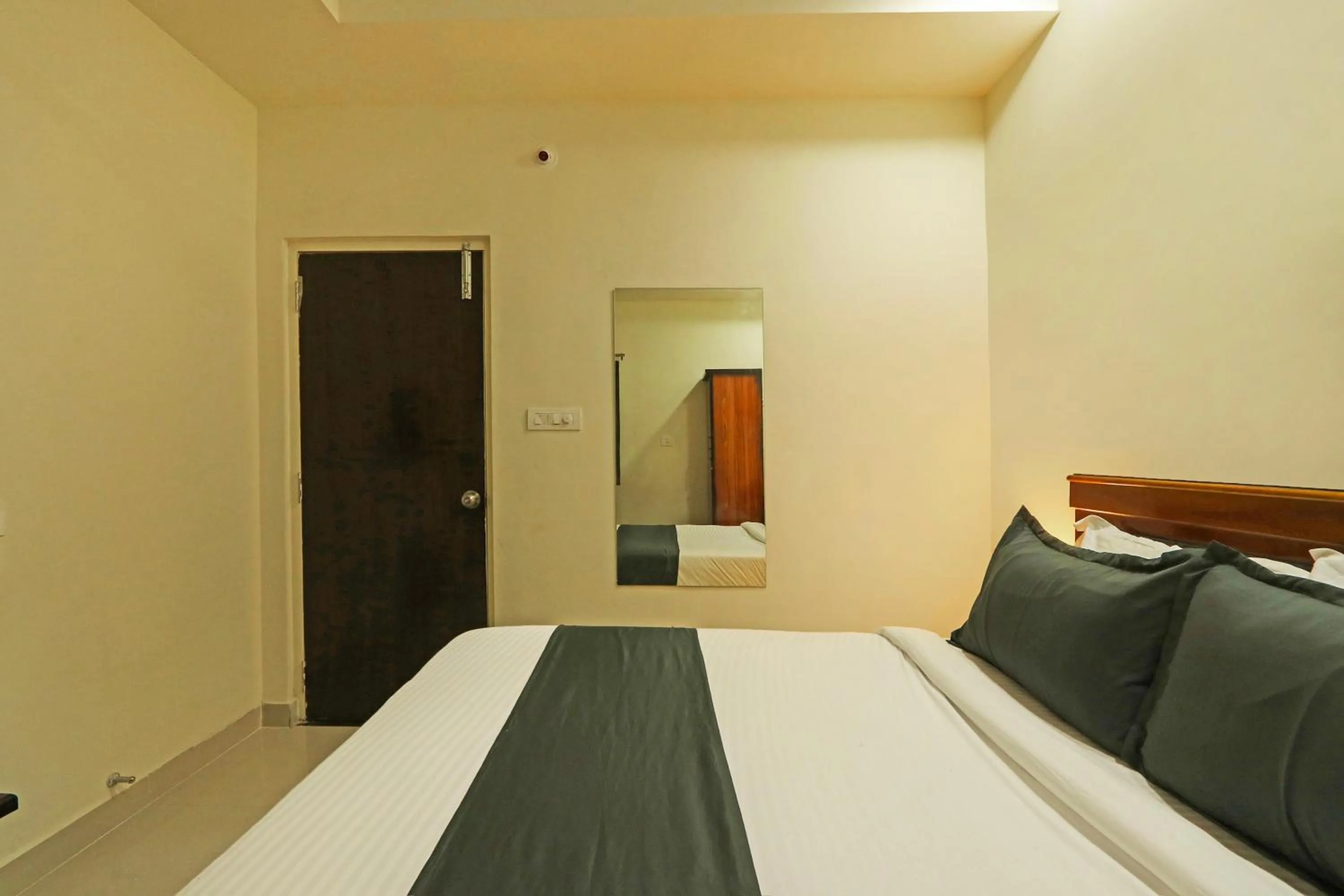 Bedroom in Hotel O JVP Hotels
