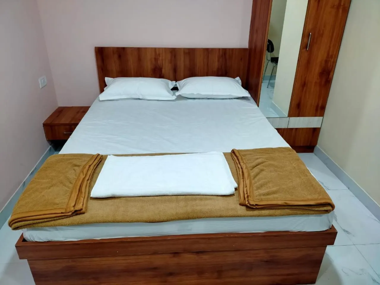 Bed in Mandara Comforts Hotel