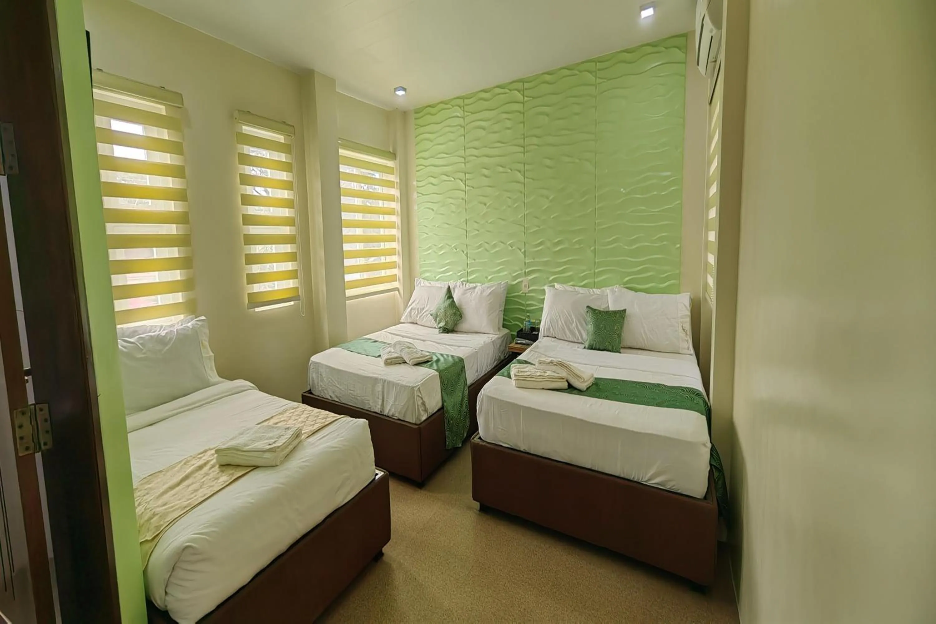 Bed in Manuela Suites Puerto Princesa near Airport
