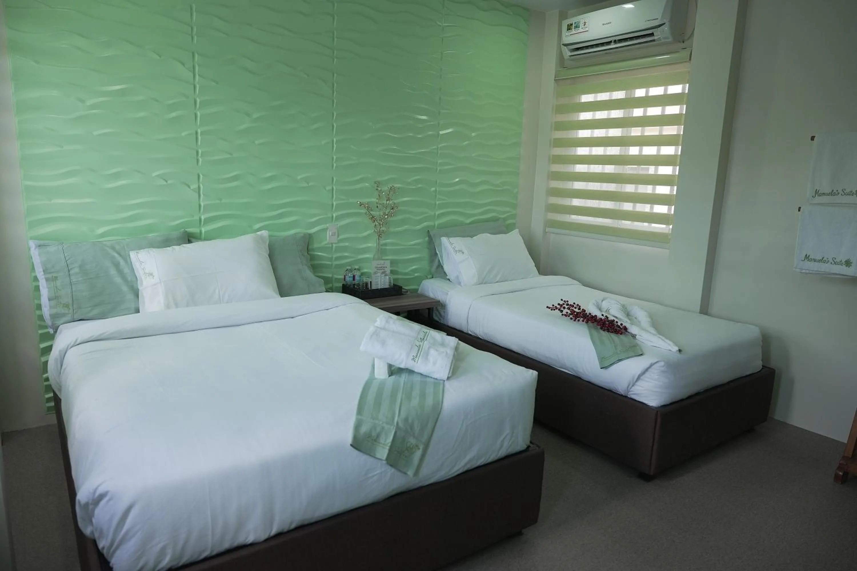 Bed in Manuela Suites Puerto Princesa near Airport